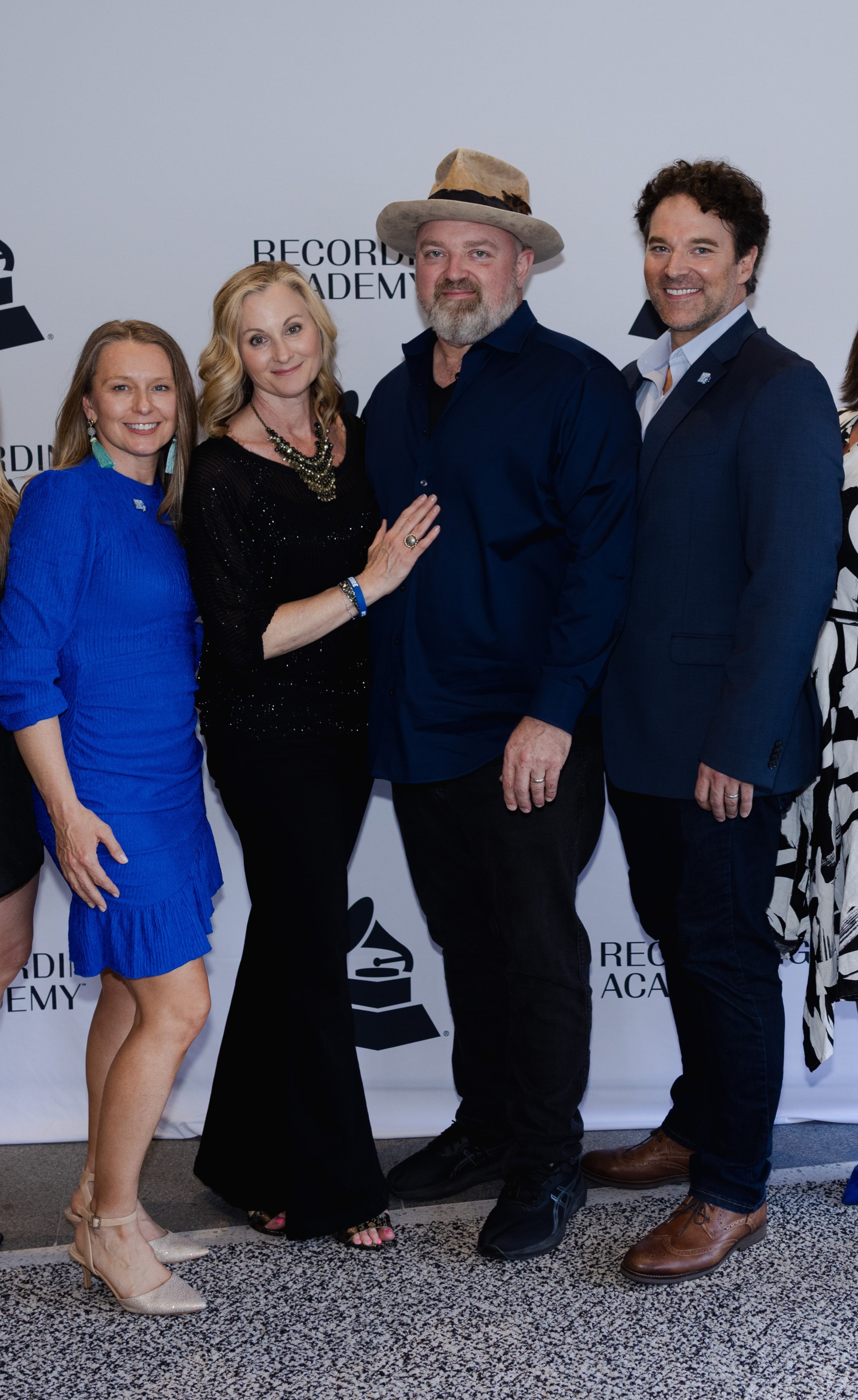 Zac Brown Band musician John Driskell Hopkins (second to right) married Jennifer Hopkins (second to left) in 2008. Nic Shefrin (left) runs his Hop on a Cure Foundation. David Hopkins is one of his three brothers. (Courtesy)