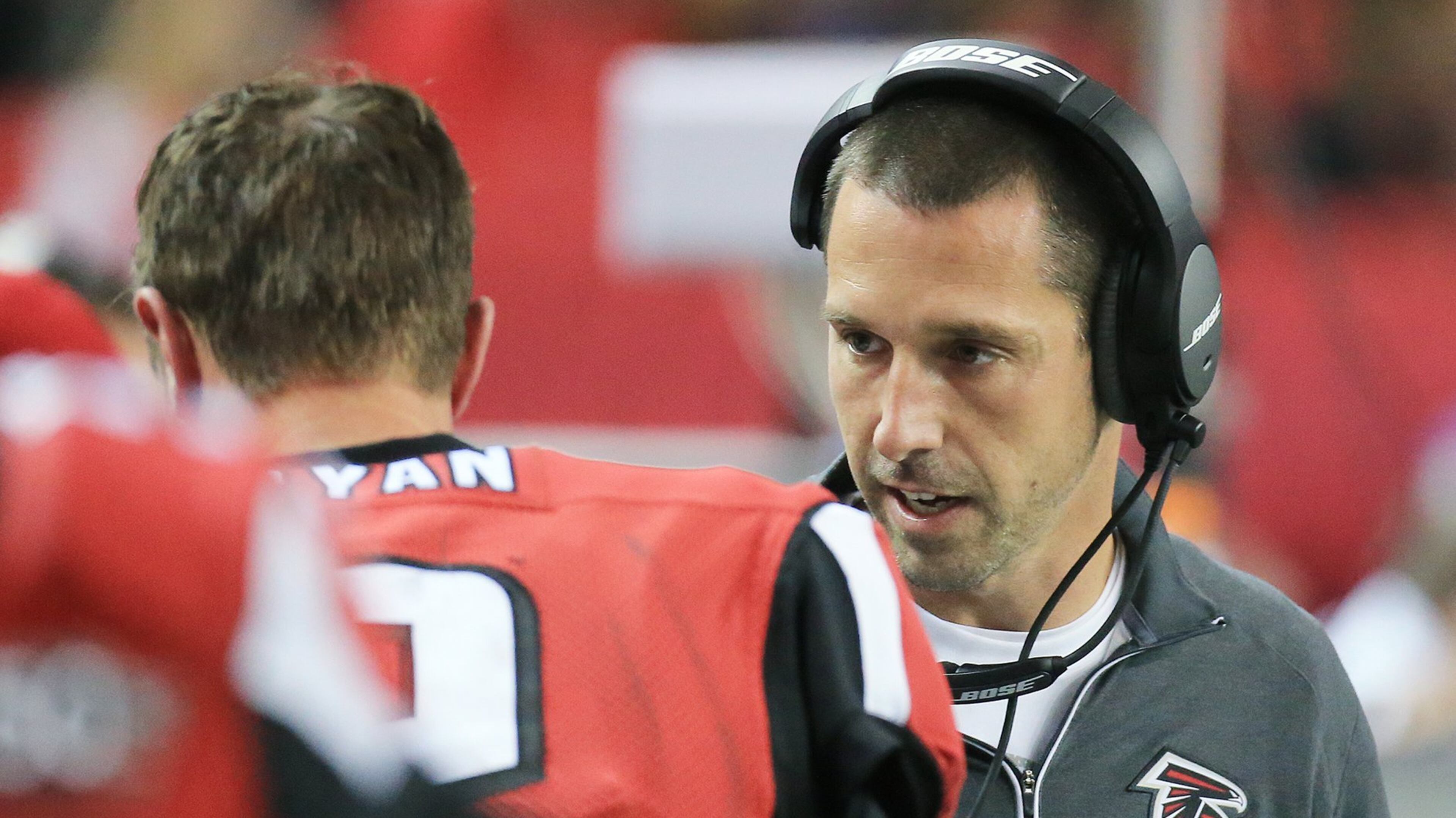 Falcons offensive coordinator Kyle Shanahan confers with quarterback Matt Ryan on the sidelines. Curtis Compton / ccompton@ajc.com