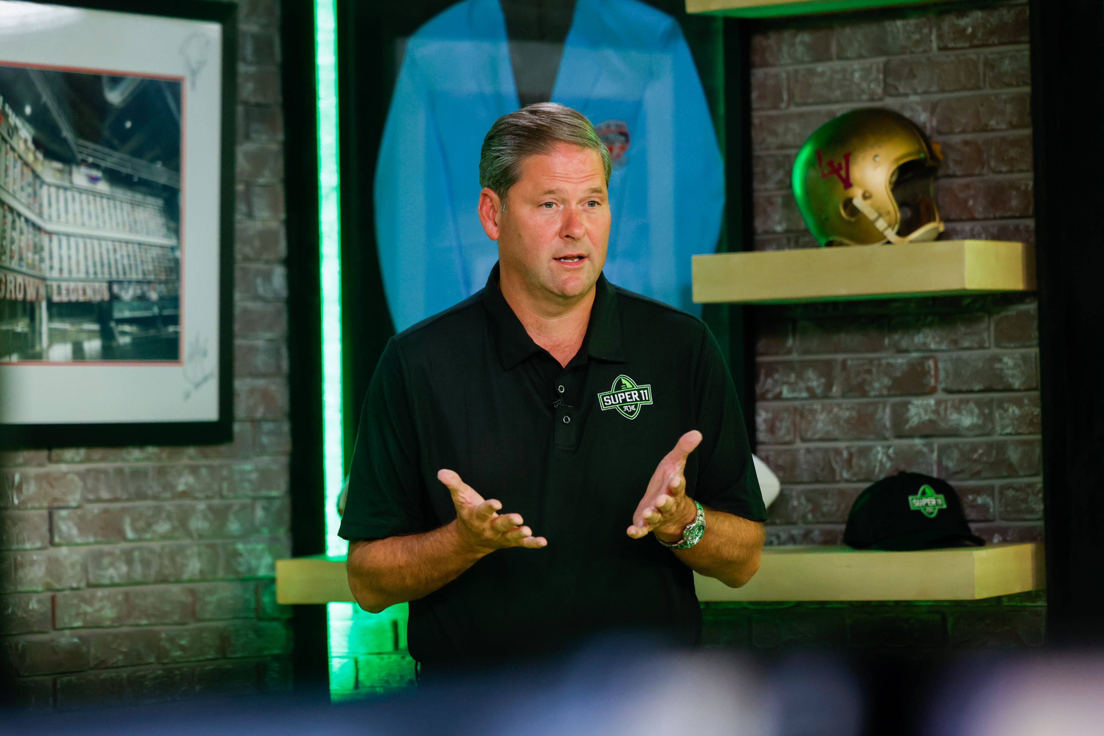 DawgNation’s Brandon Adams appears during the taping of the Super 11 reveal show at Score ATL in Roswell on Aug. 3, 2026. (Arvin Temkar/AJC)
