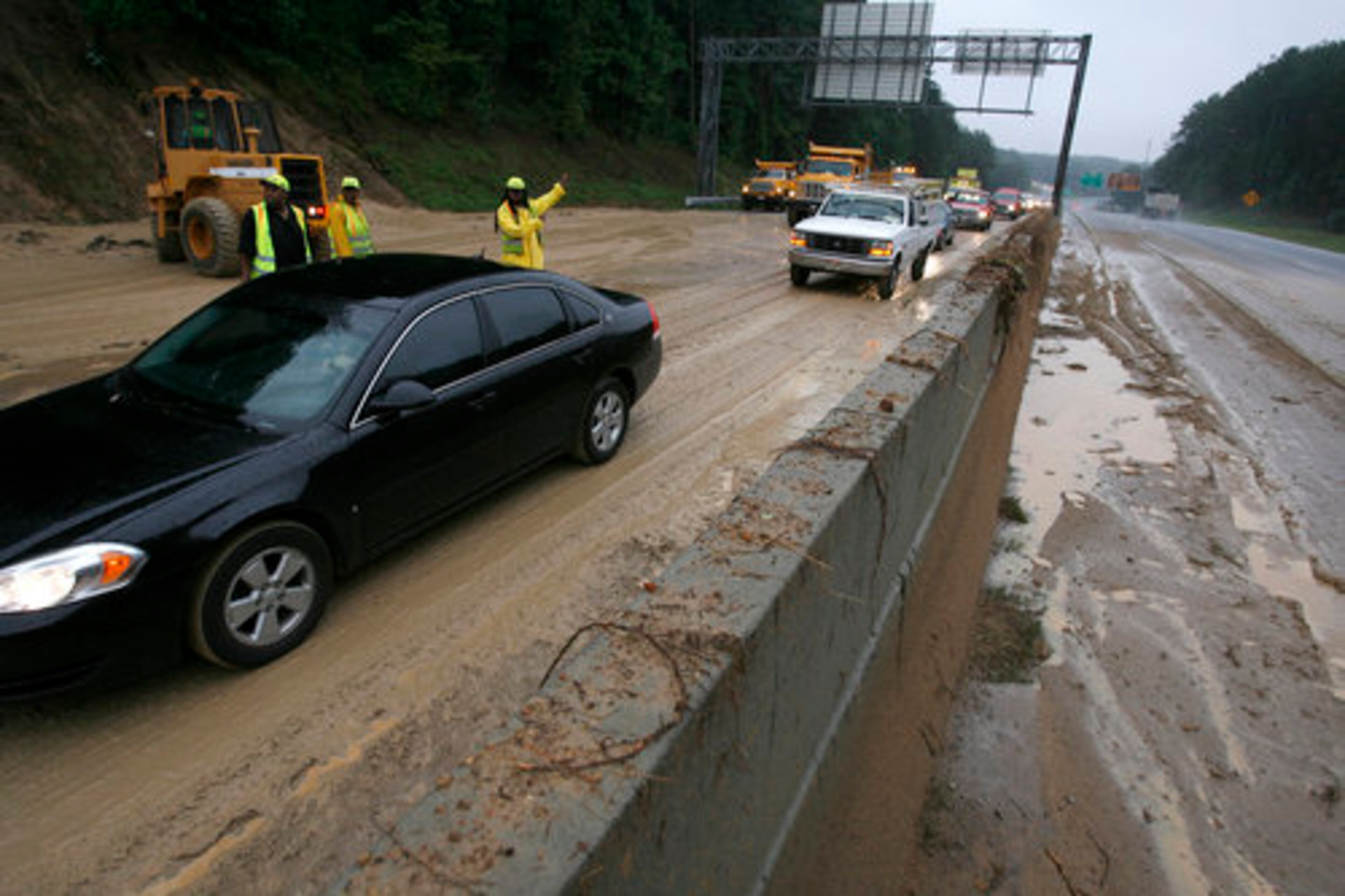 In Stone Mountain torrential rain brought traffic to a halt to all lanes at Hwy 78 due to mudslides near Hugh Howel Road Monday. North bound was open to traffic while southbound into Atlanta was at snail pace.