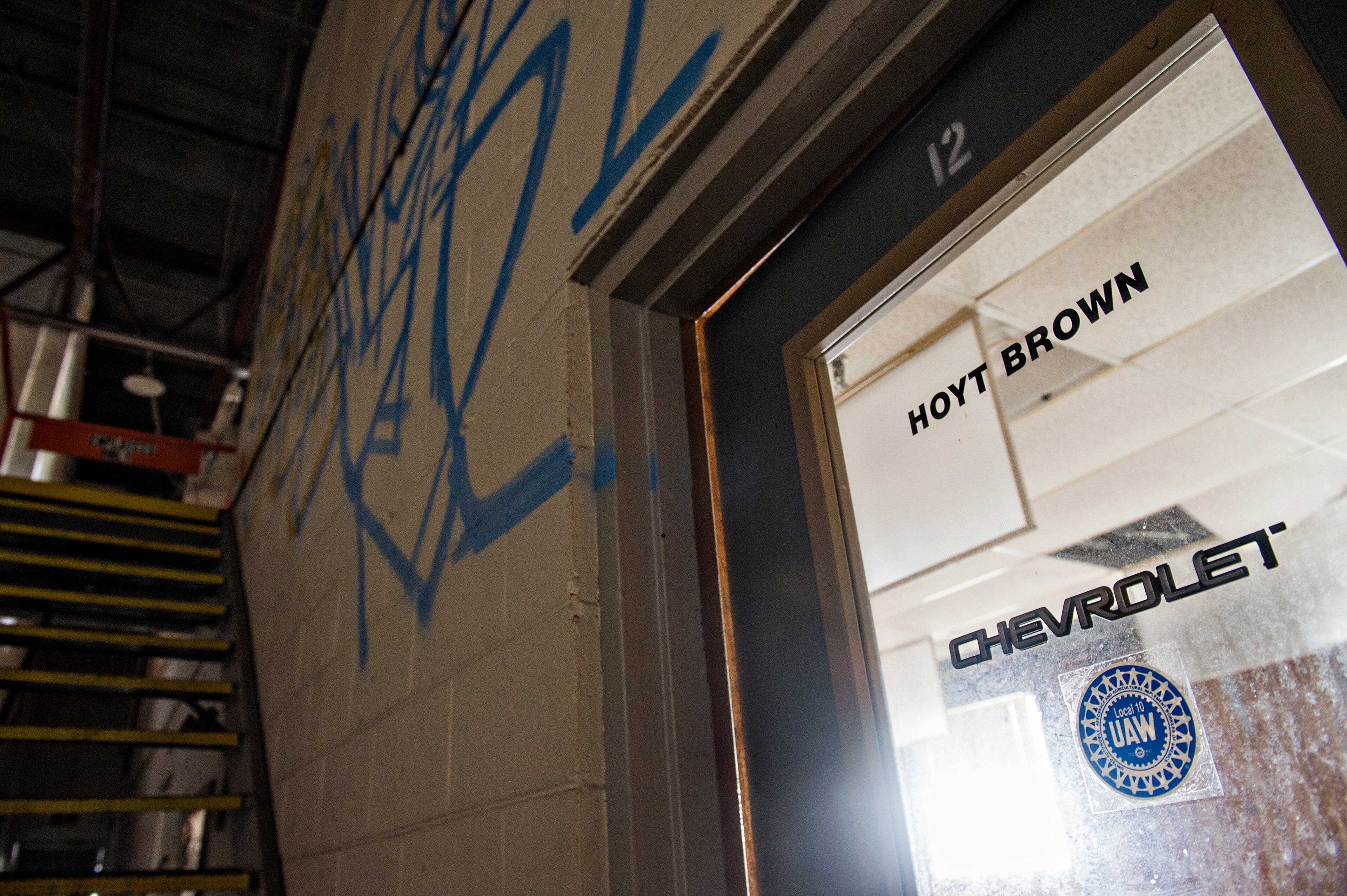 April 12, 2015 Doraville - A Chevrolet sticker remains on an office door in one of the buildings inside the General Motors assembly plant in Doraville during a #weloveatl photowalk on Sunday, April 12, 2015. 120 photographers were given special access to the plant that is being demolished and re-imagined into a multi-use space. JONATHAN PHILLIPS / SPECIAL