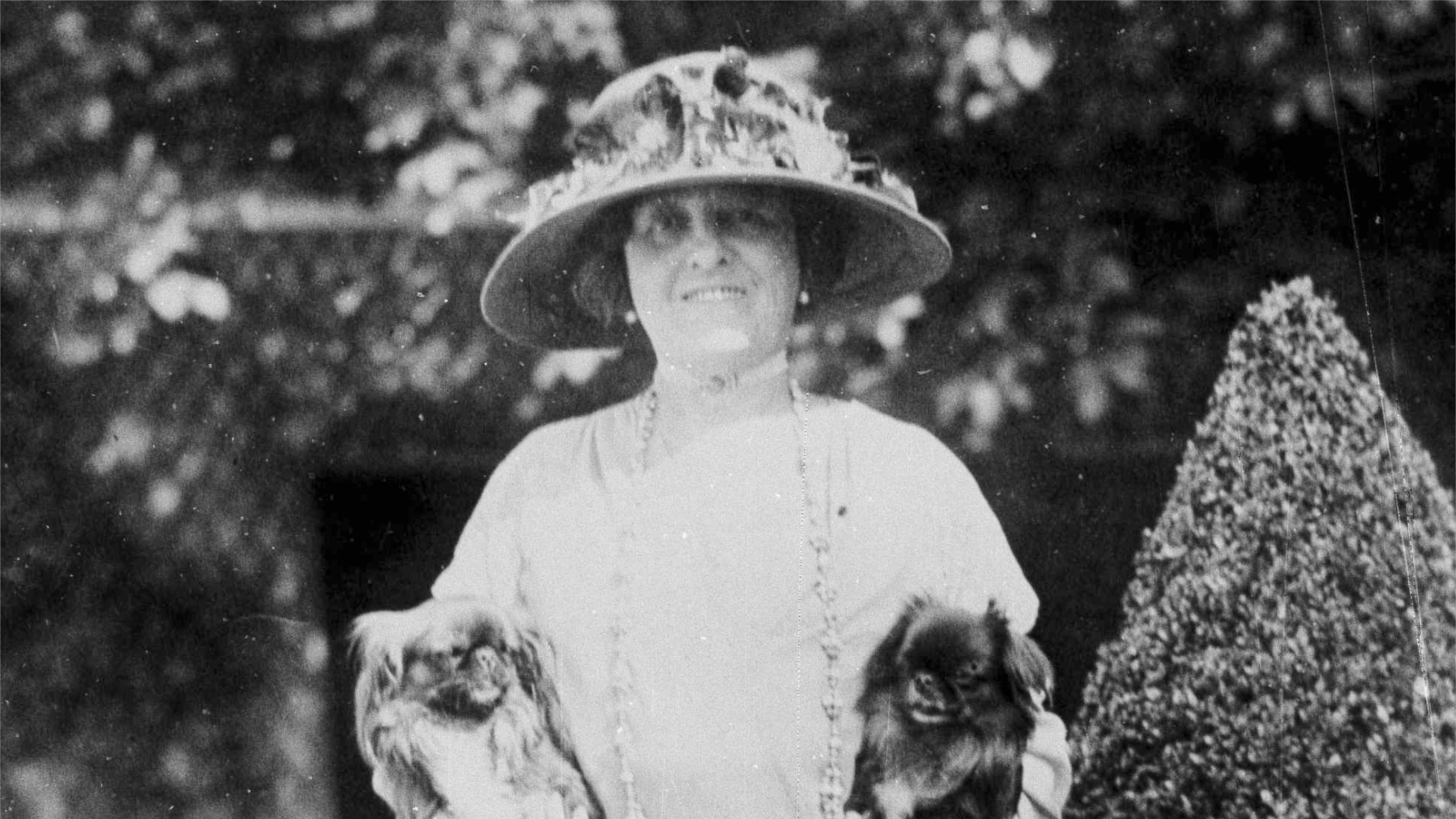 FILE - American author Edith Wharton poses with her dogs in France, 1923. (AP Photo, File)