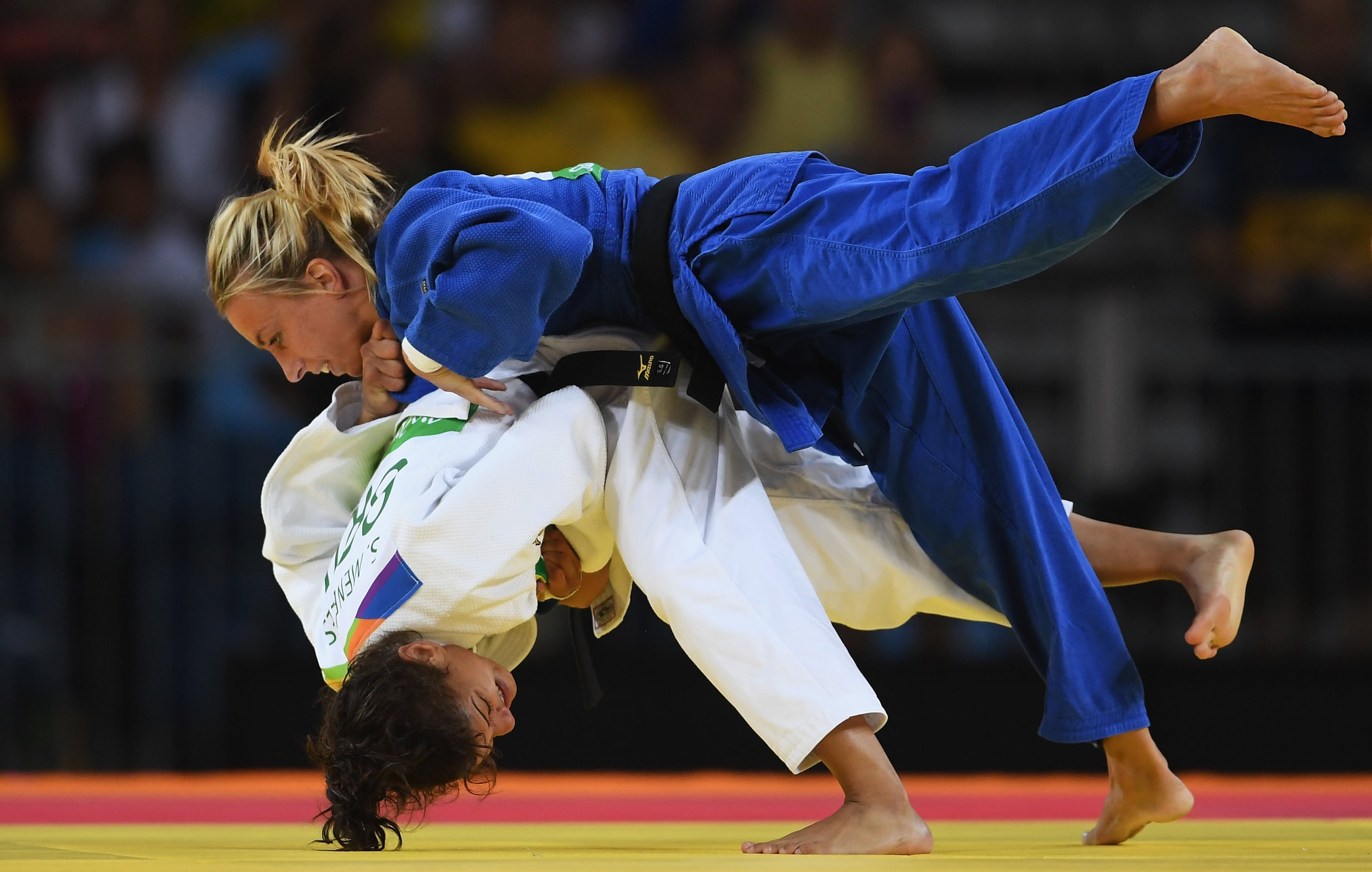 RIO DE JANEIRO, BRAZIL - AUGUST 06: Sarah Menezes of Brazil (white) competes against Charline van Snick of Belgium in the women's -48 kg Judo on Day 1 of the Rio 2016 Olympic Games at Carioca Arena 2 on August 6, 2016 in Rio de Janeiro, Brazil. (Photo by Laurence Griffiths/Getty Images)