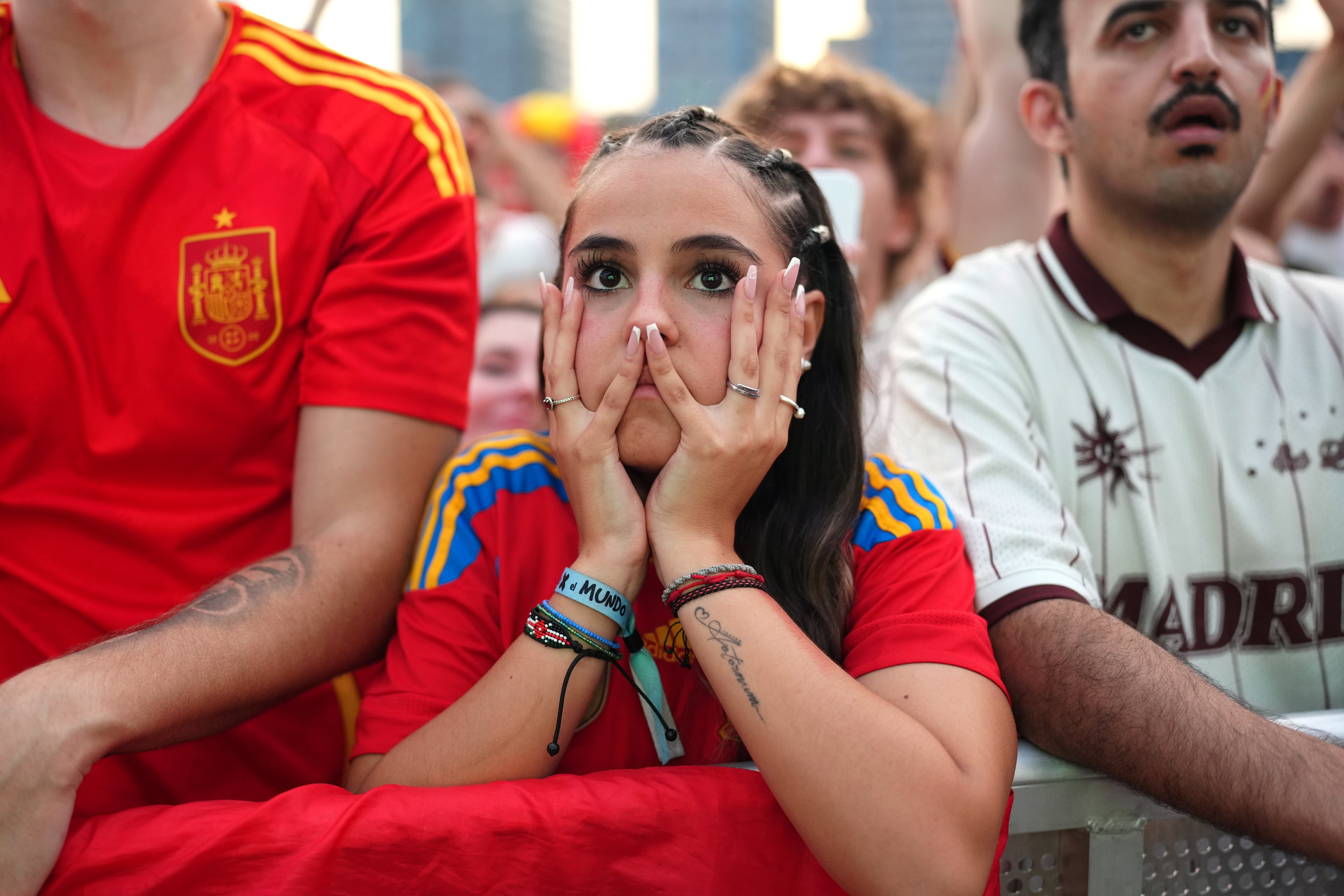 Spanish fans react while watching the World Cup final soccer match between Spain and Argentina on giant screens in Barcelona, Sunday, July 19, 2026. The match is being played in East Rutherford, N.J., near New York. (Joan Mateu Parra/AP)