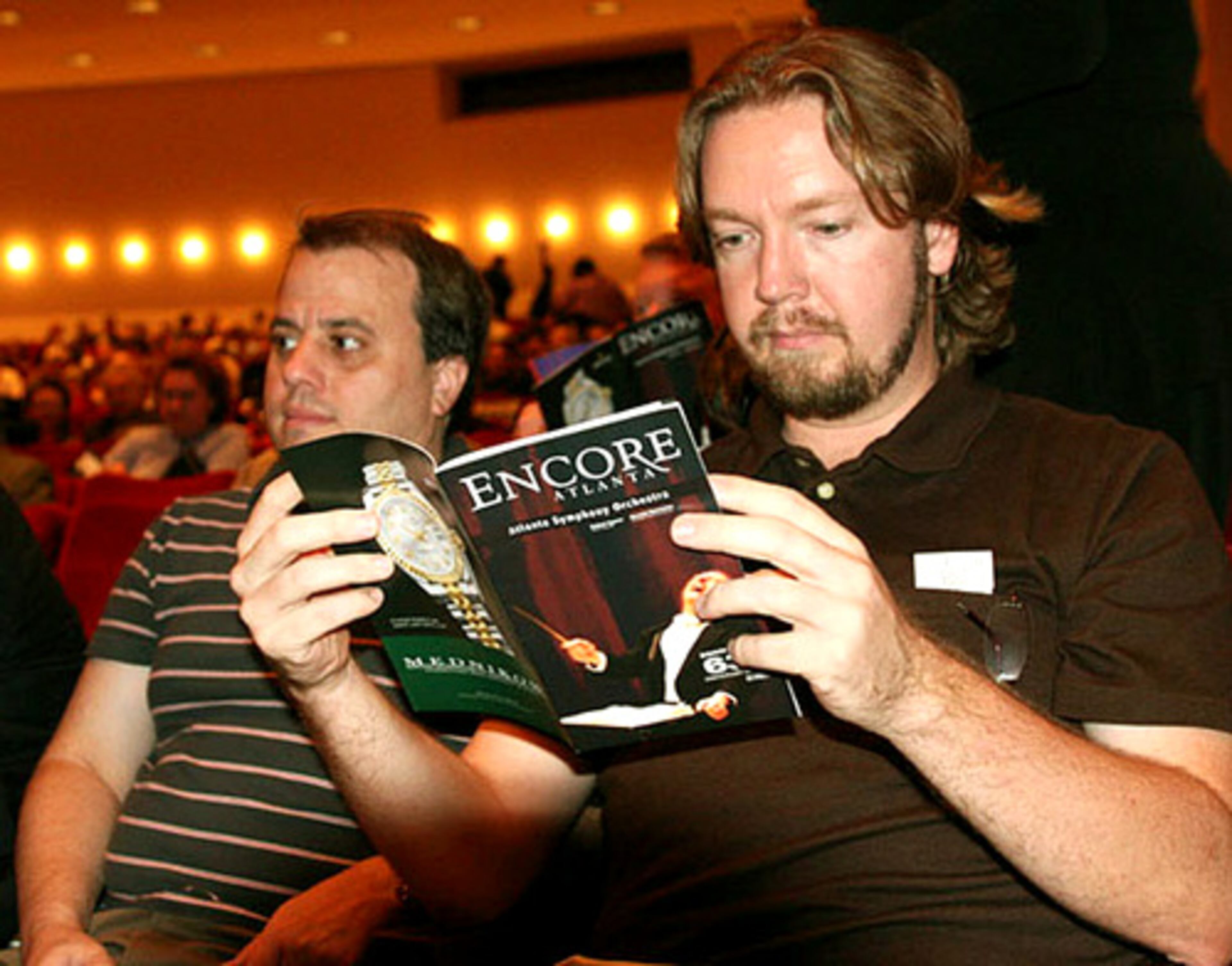 Robert Marshall (left) and Jack Rowley, East Atlanta residents, await Eartha Kitt's entrance.