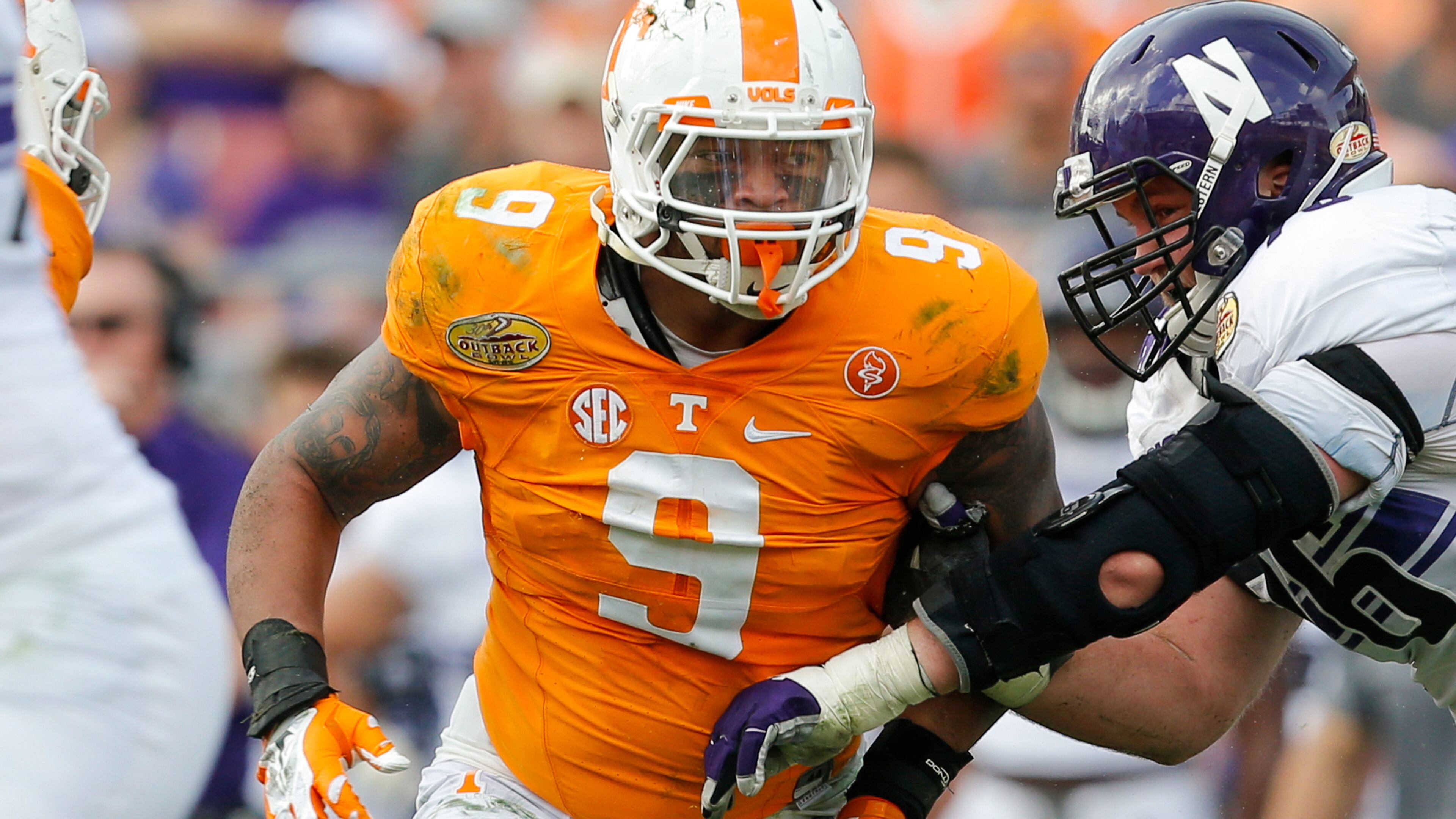 TAMPA, FL - JANUARY 1: Derek Barnett #9 of the Tennessee Volunteers against the Northwestern Wildcats during the Outback Bowl at Raymond James Stadium on January 1, 2016 in Tampa, Florida. (Photo by Mike Carlson/Getty Images)