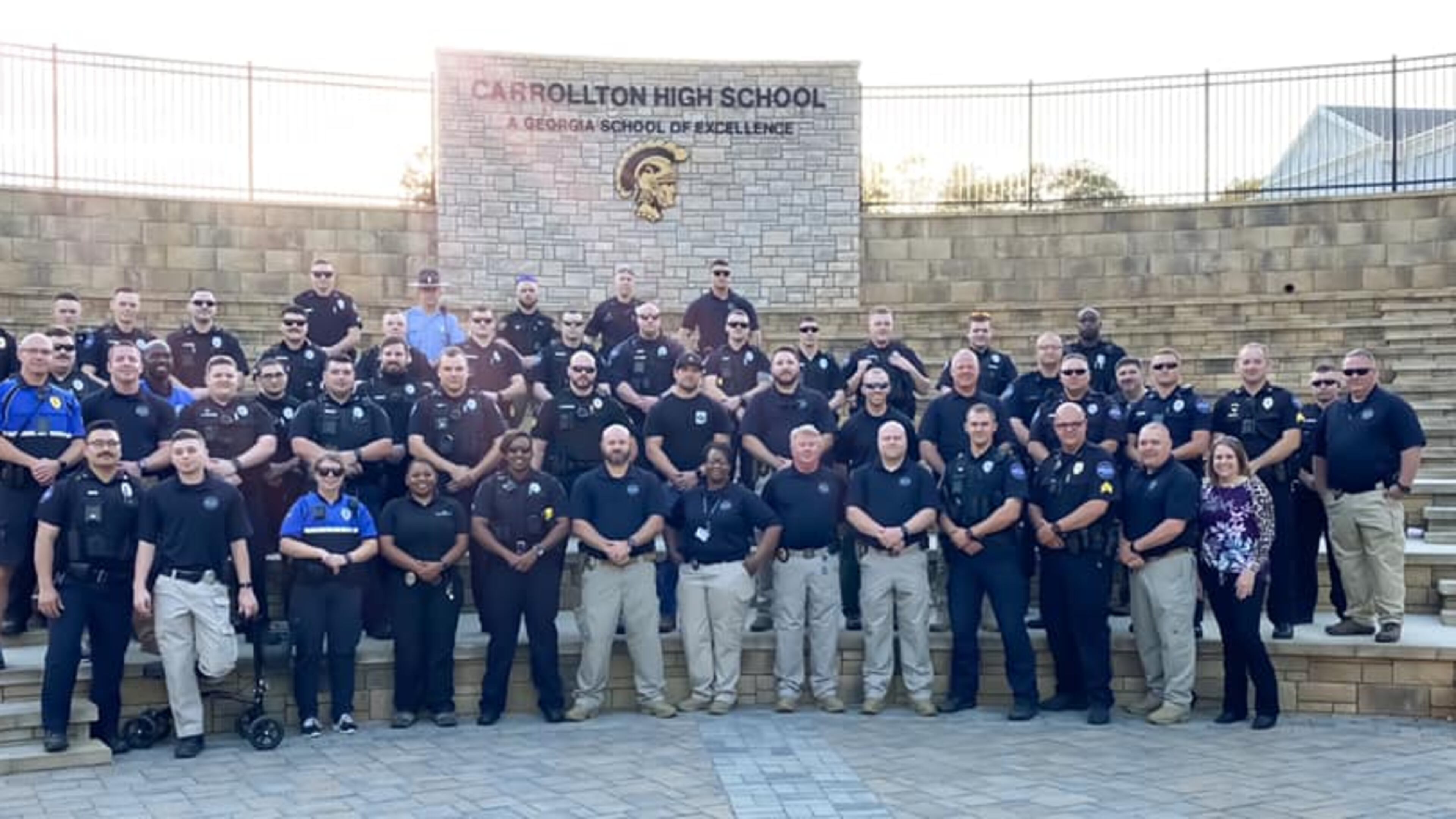 More than three dozen members of the Carrollton Police Department attended a senior honors night in the place of Sgt. Rob Holloway, who is still in the intensive care unit at Grady Memorial Hospital.