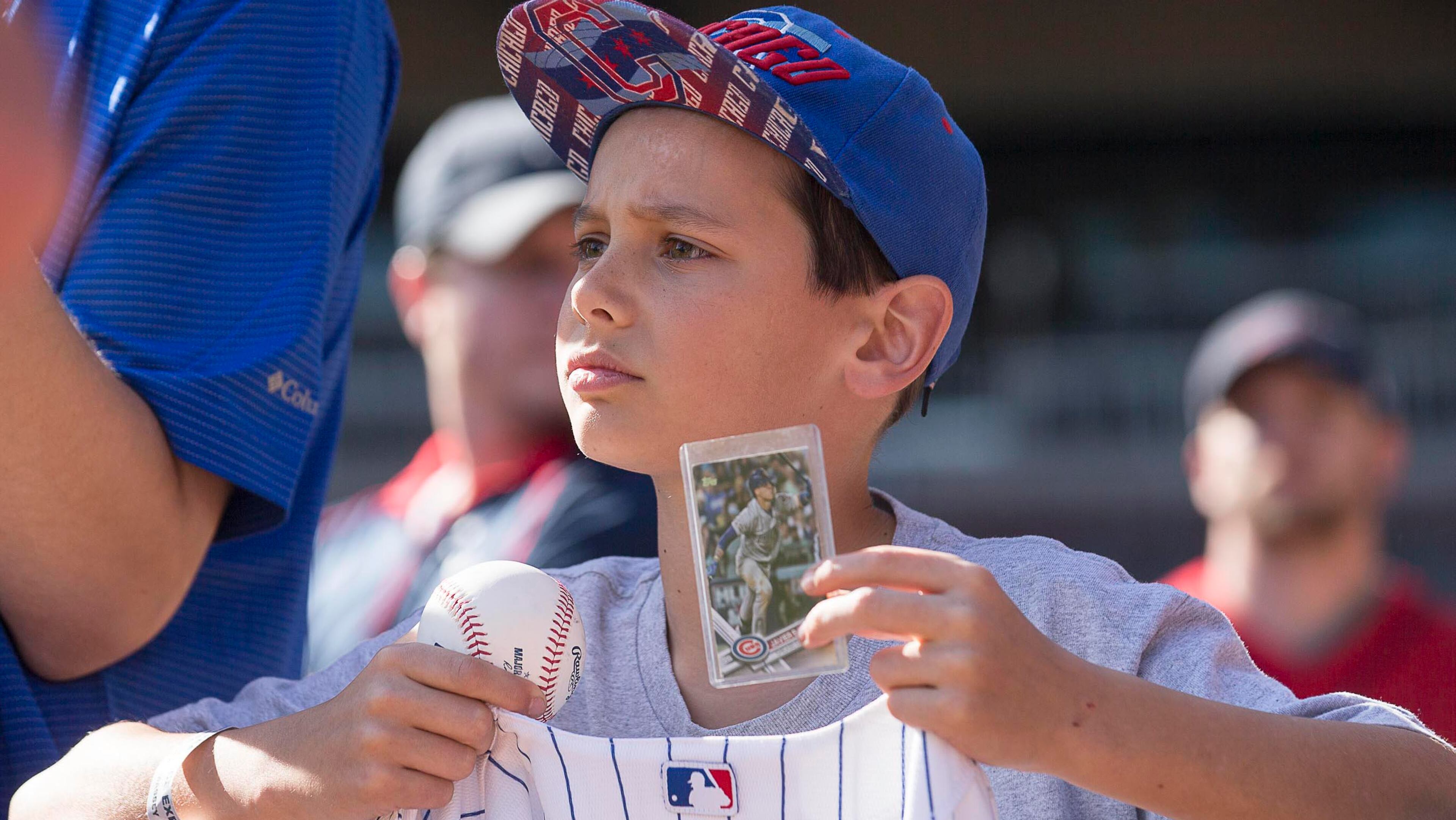 Thomas Francescon of Signal Mountain, Tenn., waits for a signature from Chicago Cubs shortstop Javier Baez before the Braves' home opener against the Cubs Monday, April 1, 2019, at SuntTrust Park in Atlanta.