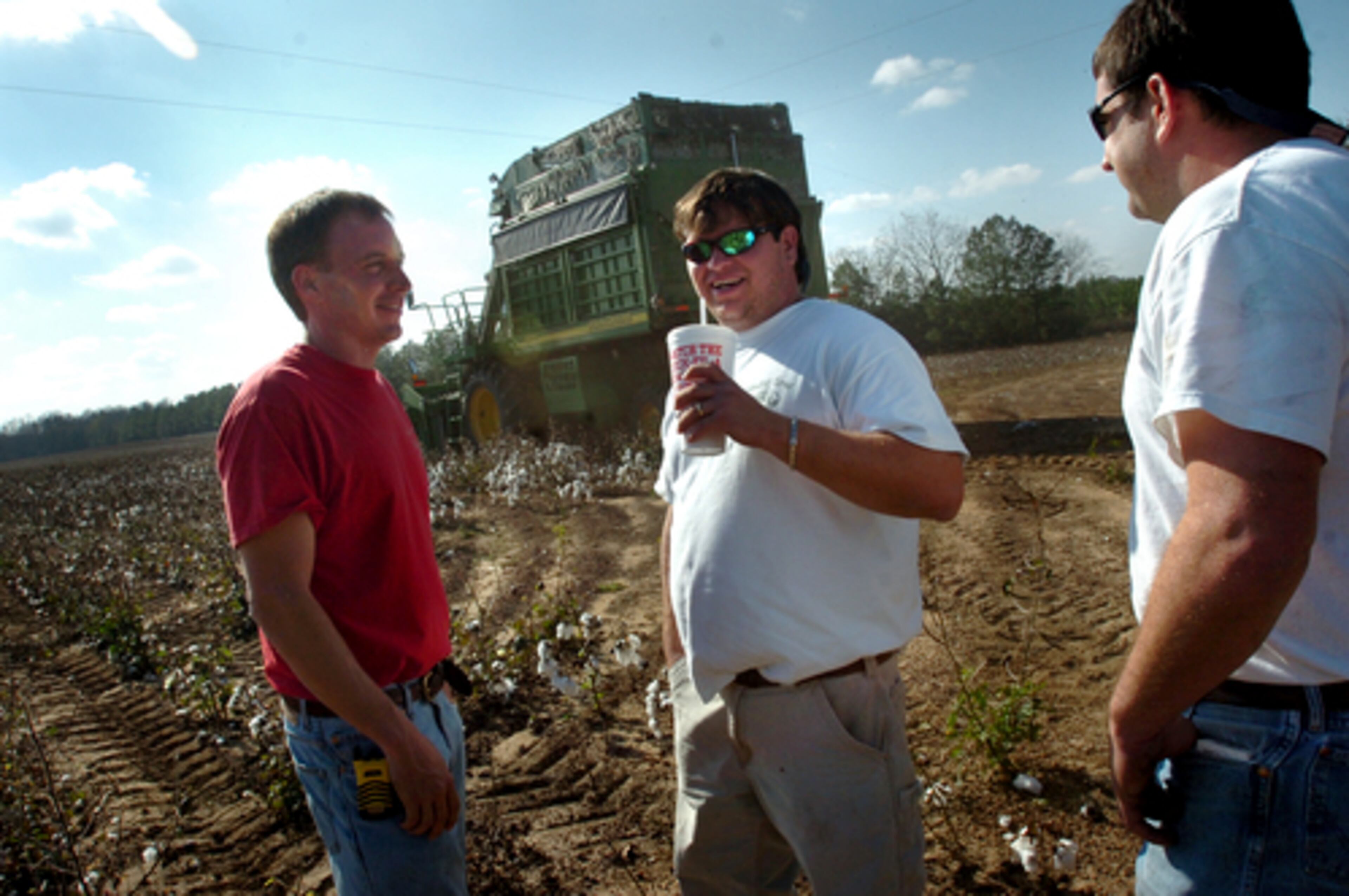 (From left) Brothers Kevin Hendrix, Cole Hendrix and Greg Hendrix take a break recently during cotton picking operations near Statesboro. "Definitely, the boll weevil was a bad boy," said Kevin Hendrix.