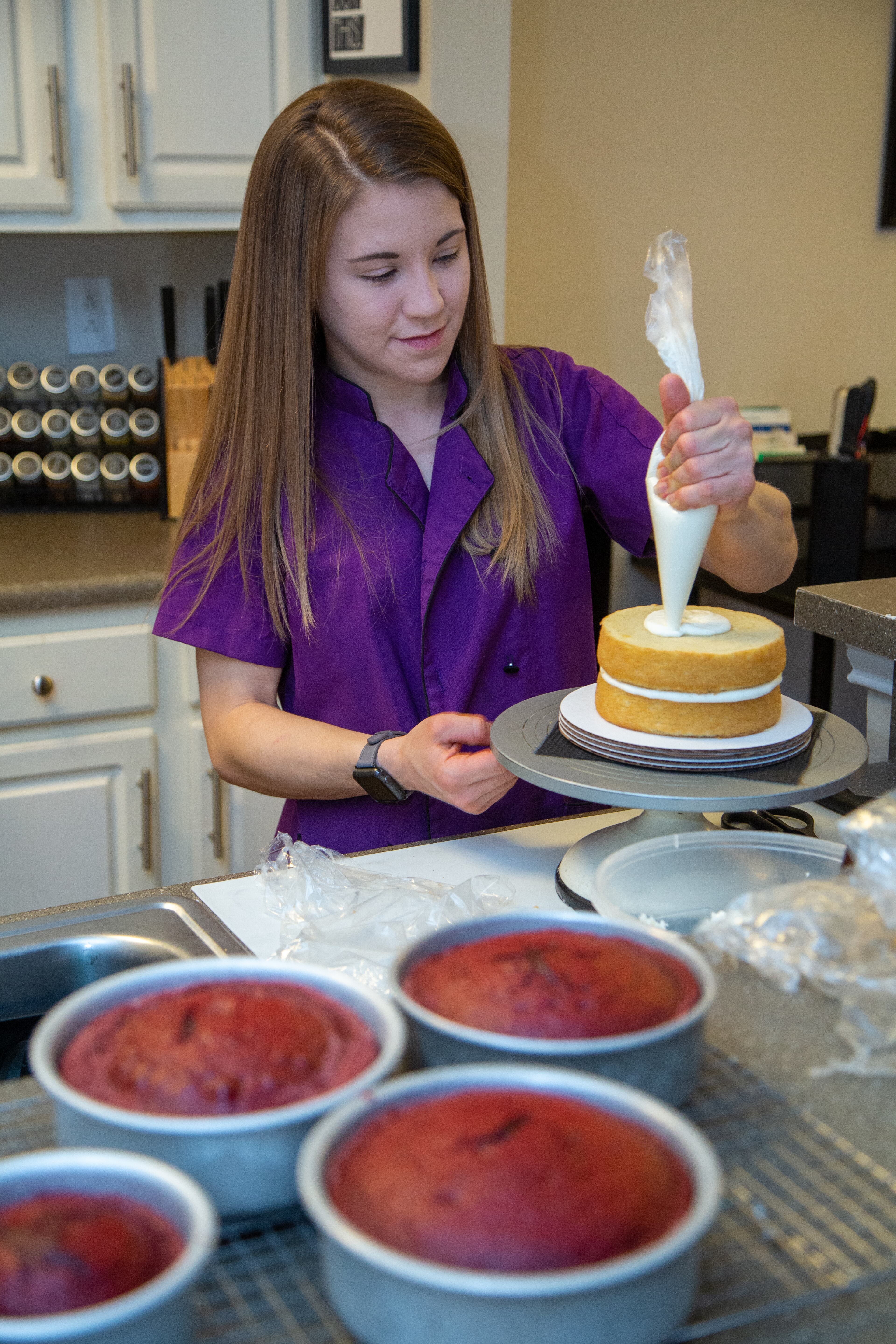 Heaven Waits of Heavenly Bakes works in the kitchen of her Buford apartment. Her business was helped by The Bert Show’s “Save my small business” promotion, which gives free ads to small businesses who have been hit hard by the pandemic. PHIL SKINNER FOR THE ATLANTA JOURNAL-CONSTITUTION.