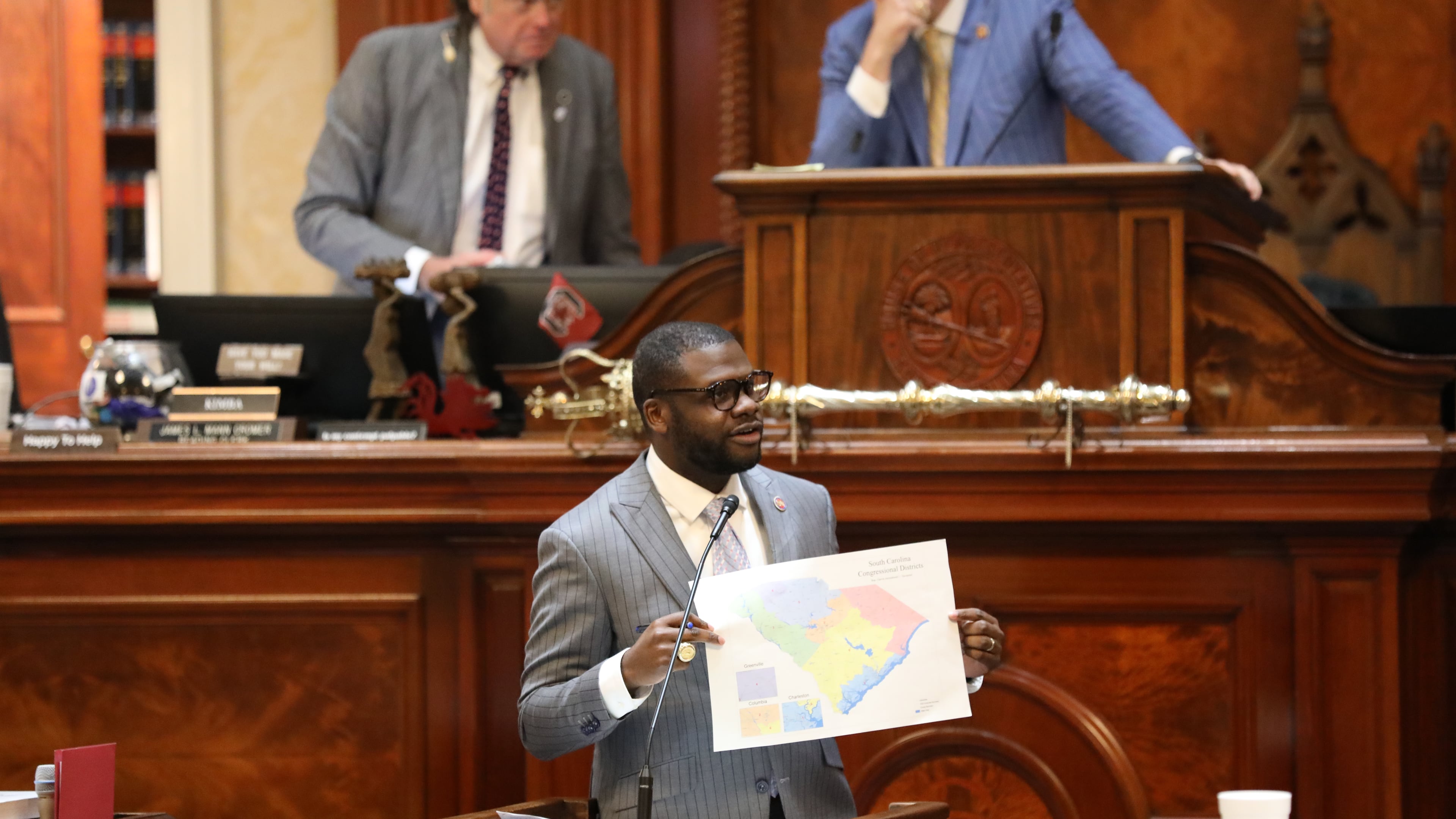 Democratic South Carolina Rep. Kambrell Garvin presents his version of a map for new congressional districts during the House session on redistricting on Monday, May 18, 2026, in Columbia, S.C. (AP Photo/Jeffrey Collins)