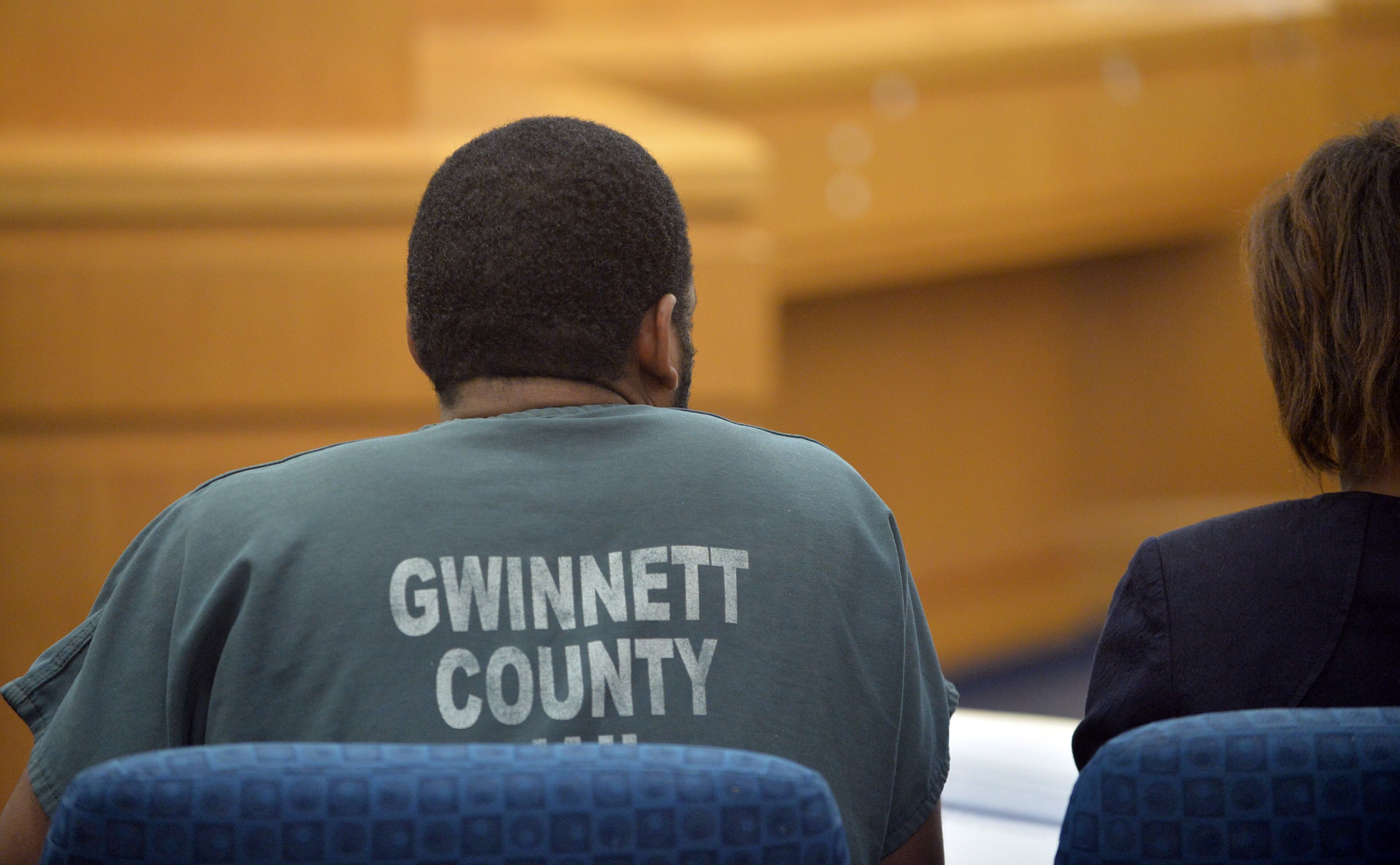 Recardo and Therian Wimbush appear before Gwinnett County Superior Court Judge Karen Beyers during a bond hearing Tuesday, August 5, 2014. The former Georgia Tech football star and his wife were denied bond. They are accused of locking their 13 year old son in the basement for months. KENT D. JOHNSON/KDJOHNSON@AJC.COM
