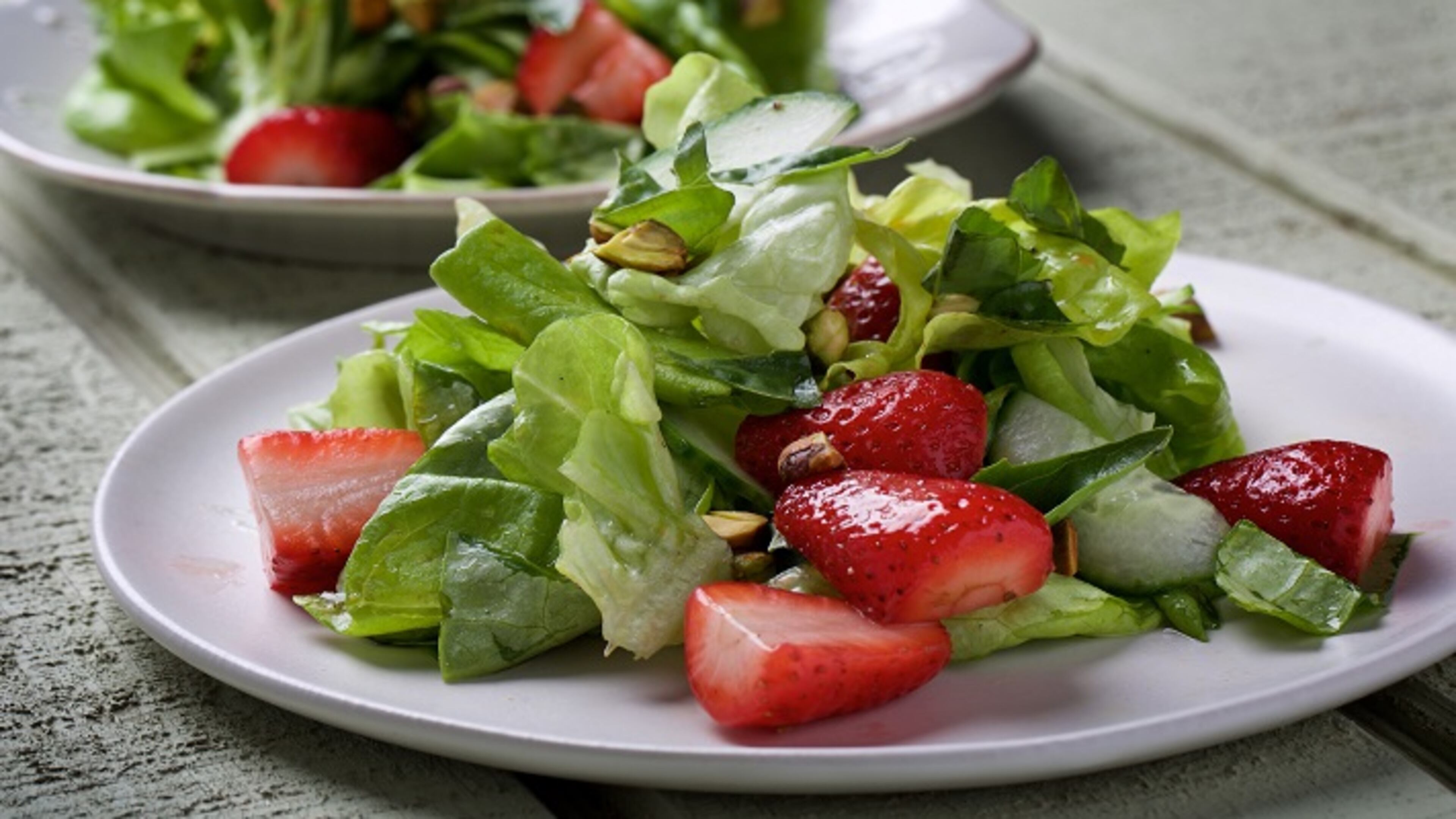 Tender Green Salad With Strawberries, Cucumber, Pistachio and Basil. MUST CREDIT: Photo by Deb Lindsey for The Washington Post.