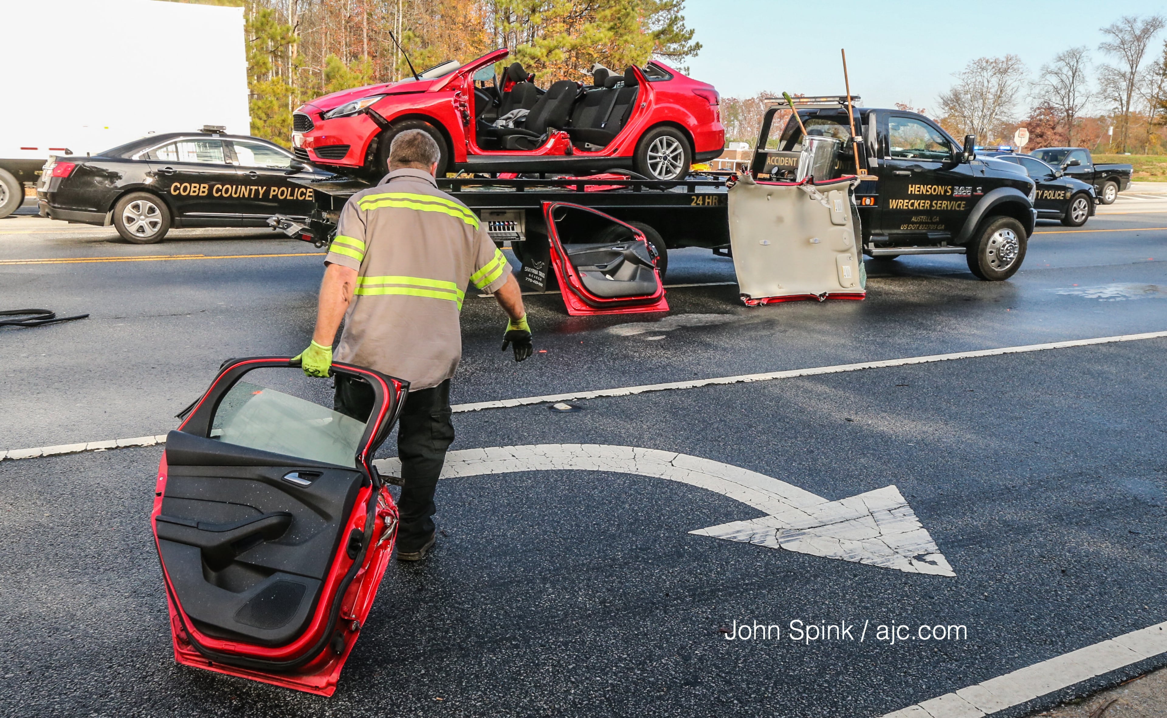 Cobb County fire crews that responded to the accident had to cut off the top of the car to free the driver. JOHN SPINK / JSPINK@AJC.COM