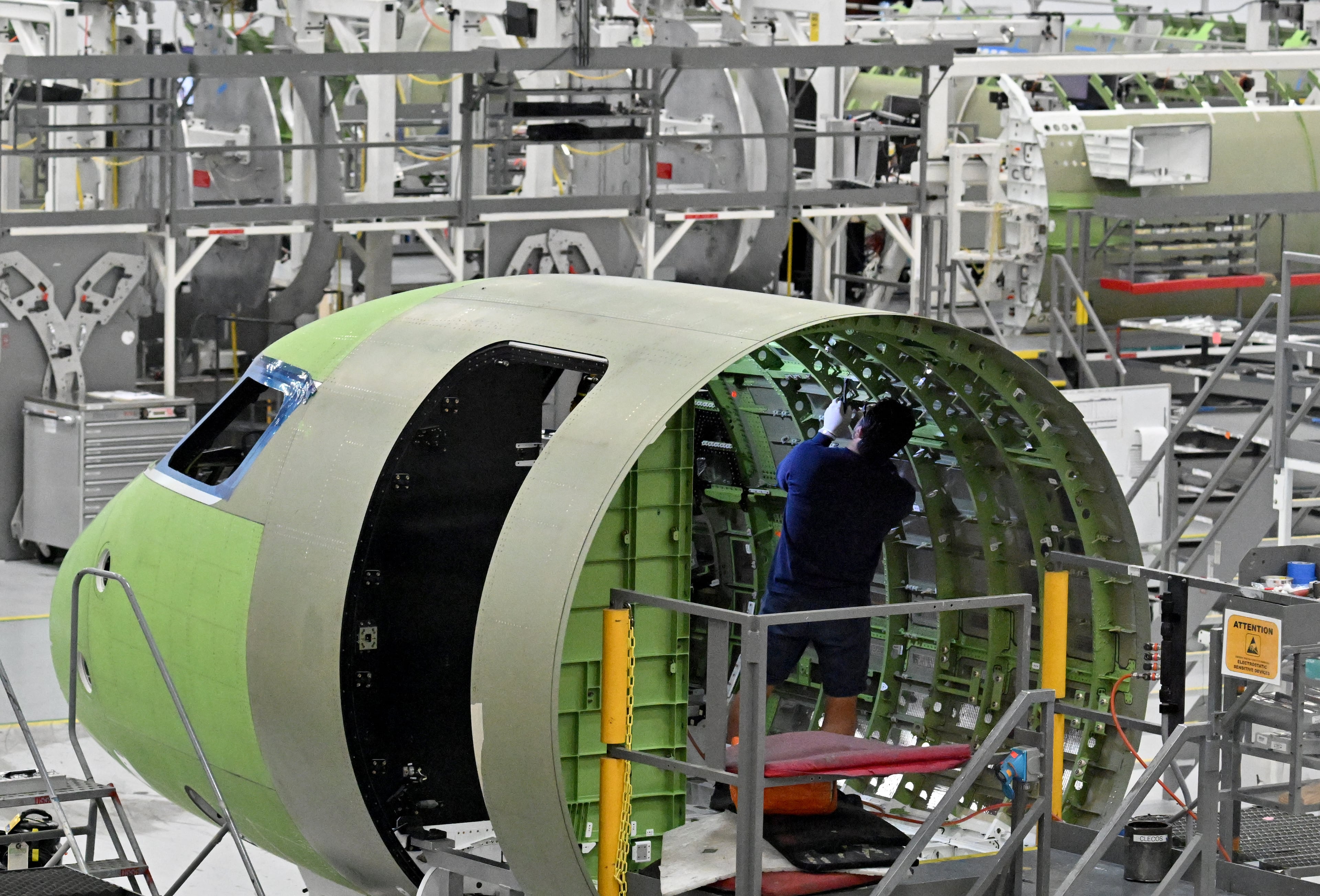 A worker works at Gulfstream’s manufacturing facility at Gulfstream Aerospace Corporation in December. (Hyosub Shin/AJC)