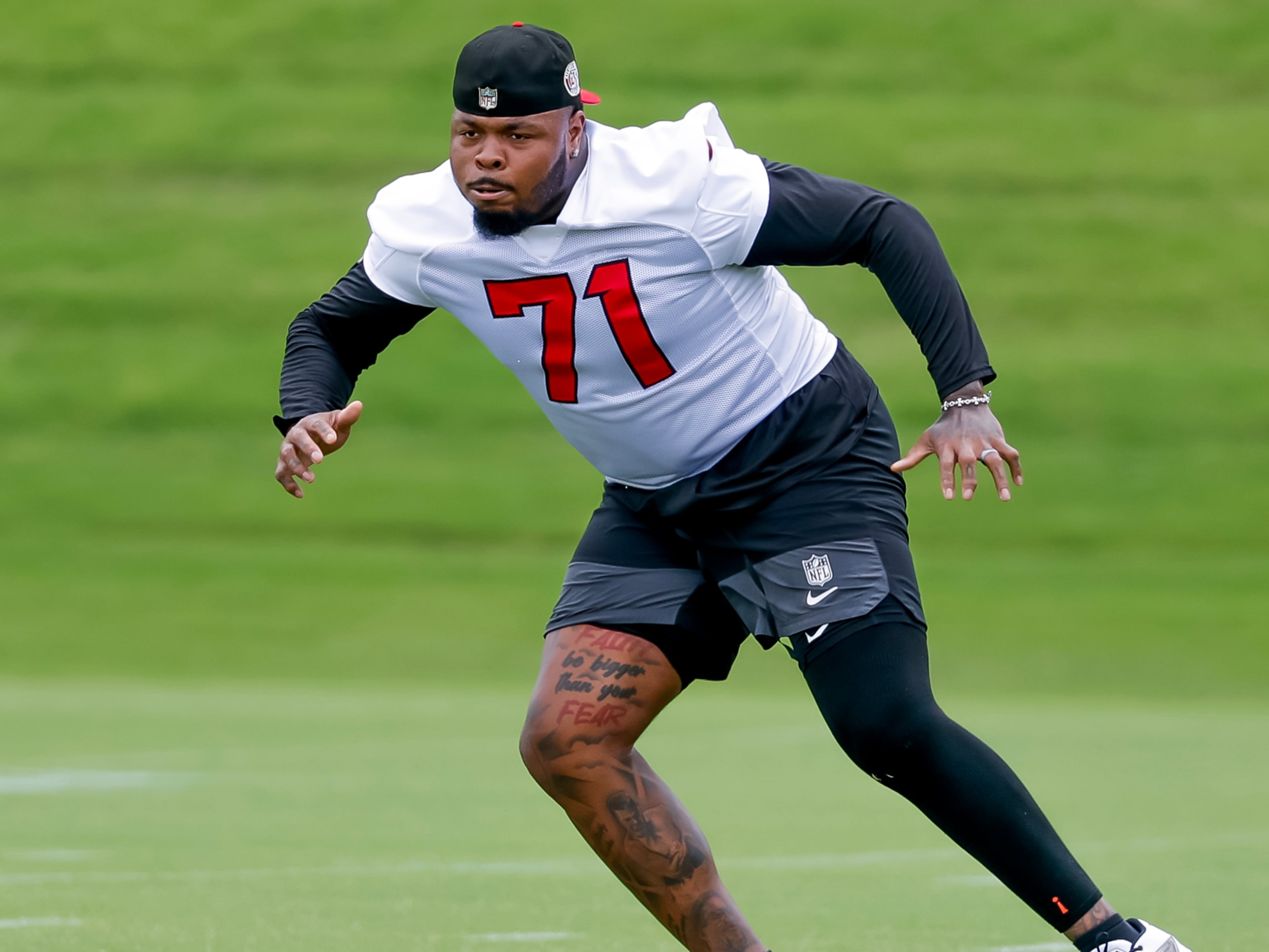 Falcons offensive tackle Jawaan Taylor, shown at practice this summer, missed all of OTAs, mandatory minicamp and the first nine practices of training camp because of knee surgery in March. (Erik S. Lesser for the AJC)