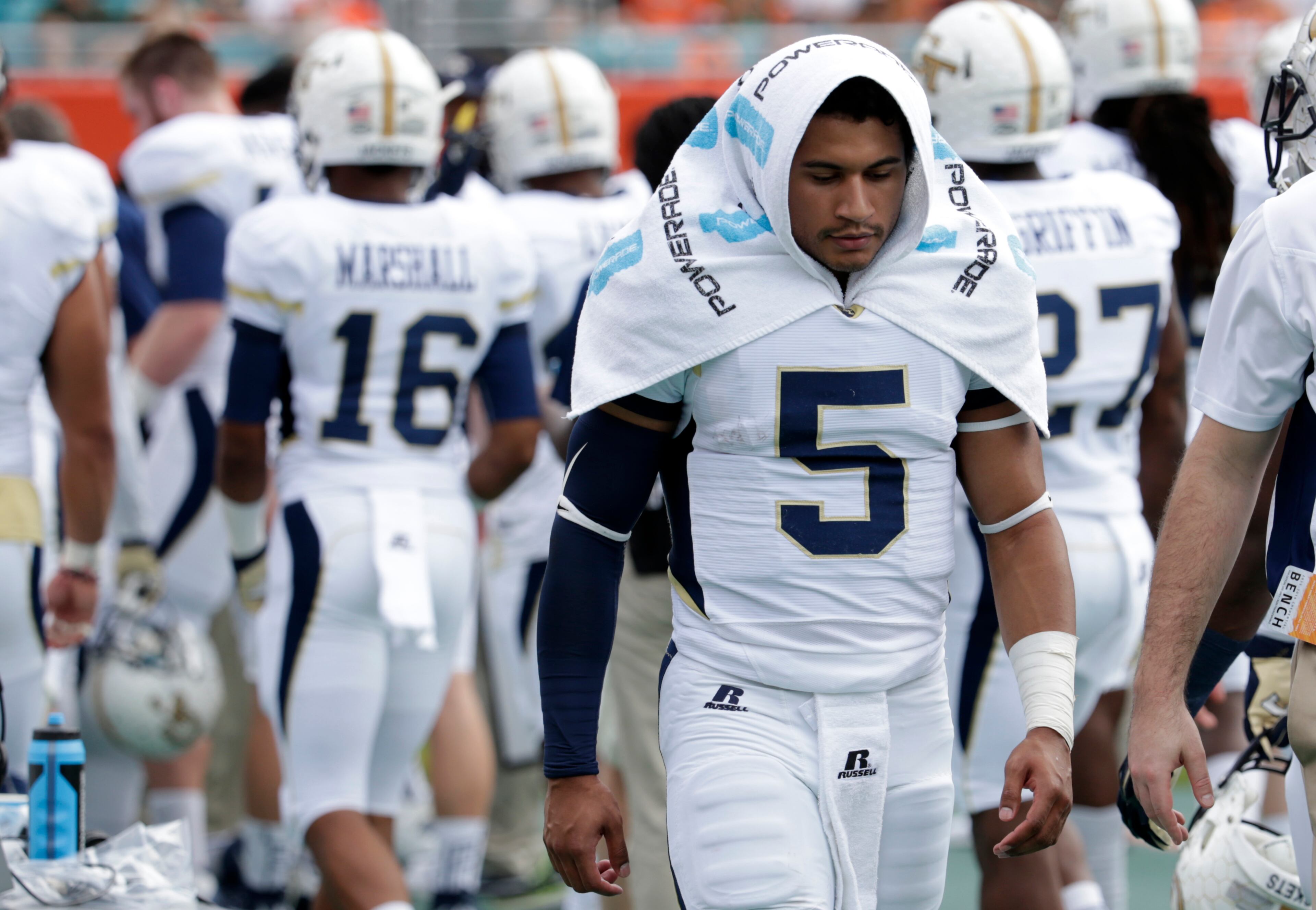 Georgia Tech quarterback Justin Thomas (5) walks on the sideline during the first half of an NCAA college football game against Miami, Saturday, Nov. 21, 2015 in Miami Gardens, Fla. (AP Photo/Lynne Sladky)
