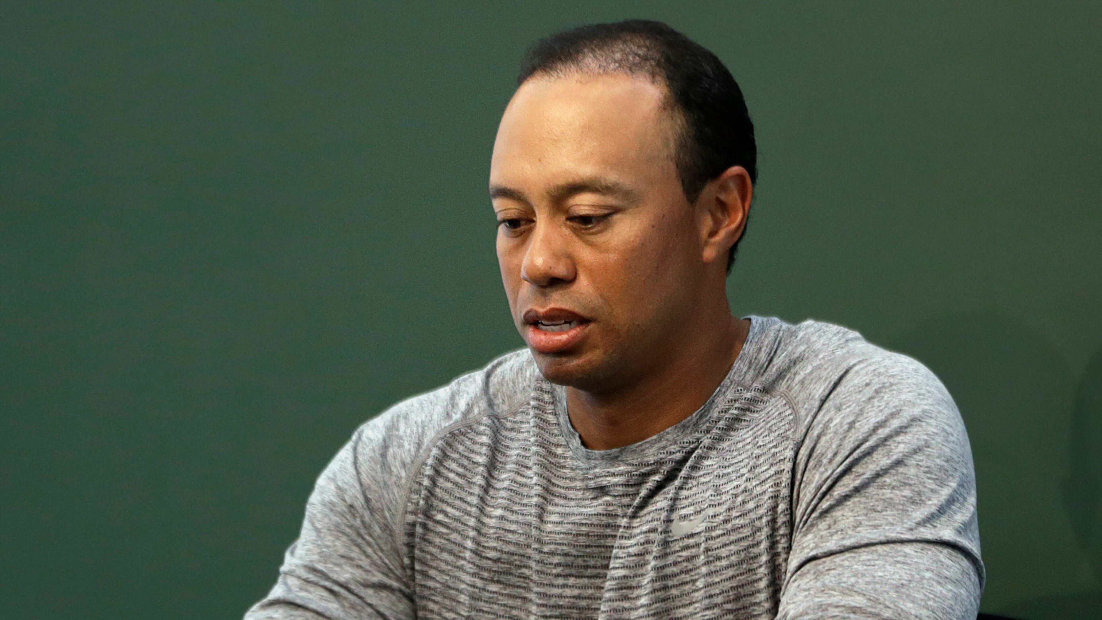 In this March 20, 2017, file photo, Tiger Woods prepares to sign copies of his new book at a book signing in New York. Police say Woods has been arrested on a DUI charge in Florida. (AP photo)