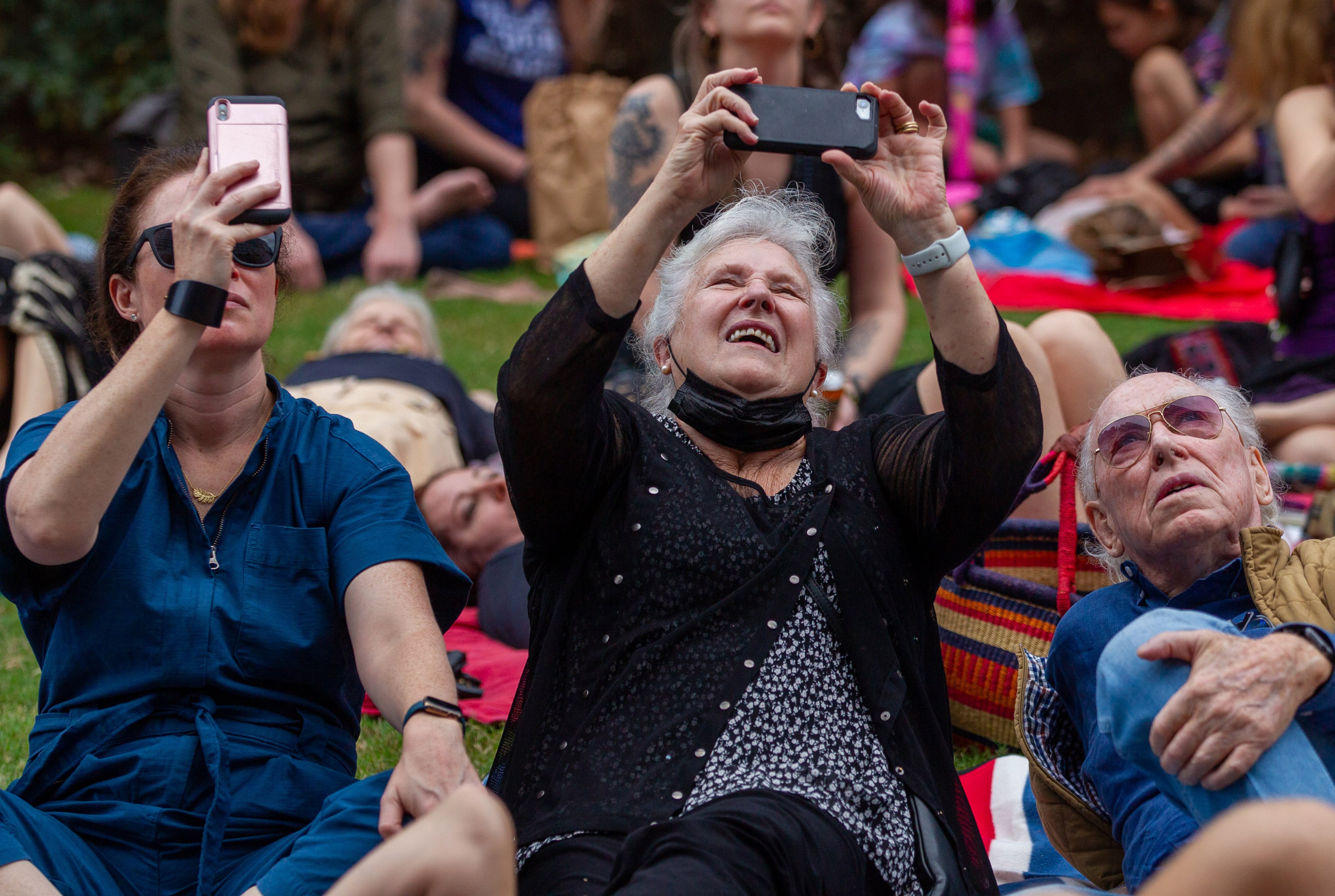 People take photos of the Bandaloop dancers performing on the side of a building facing the Atlanta Beltline on Sunday, October 3, 2021. (Photo: Steve Schaefer for The Atlanta Journal-Constitution)