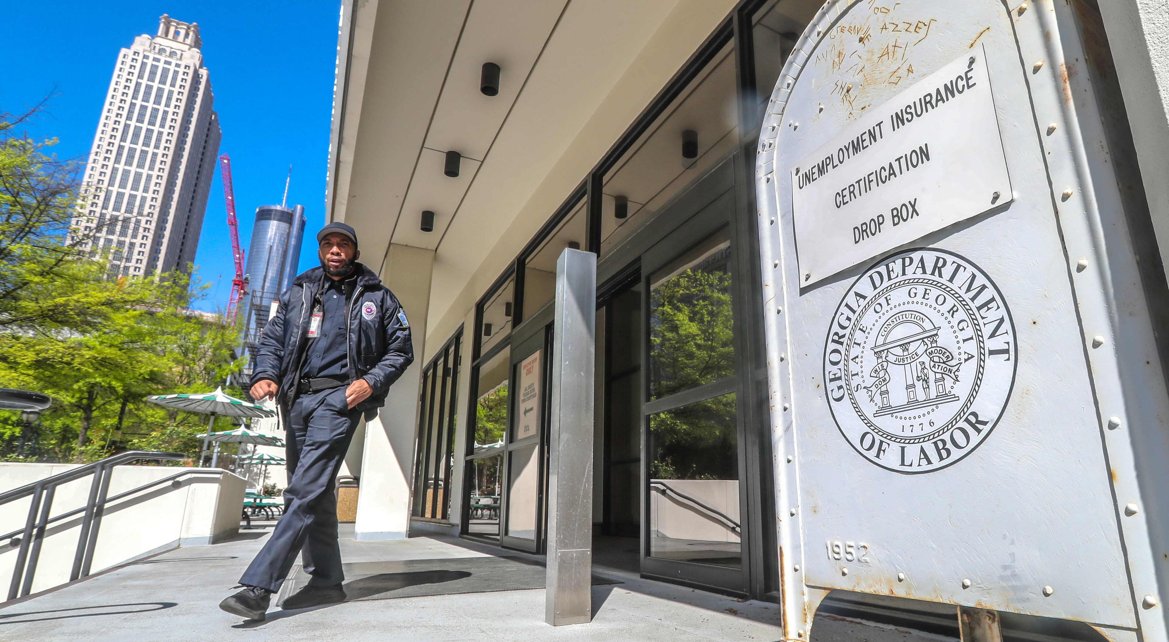 April 2, 2020 Atlanta: A security guard at the Georgia Department of Labor at 223 Courtland St NE in Atlanta walks past the unemployment certification drop box in front of the office on Thursday, April 2, 2020. Unemployment claims have skyrocketed since the COVID-19 pandemic has shut down businesses across the state and country. Georgiaâs coronavirus cases surpassed 5,000 Thursday, and the number of deaths across the state continue to grow. The latest data from the Georgia Department of Public Health shows 5,348 confirmed cases, an increase of about 13% from the 4,748 cases reported Wednesday night. Nine more Georgians have died as a result of COVID-19, the disease caused by the novel coronavirus, bringing the stateâs death toll to 163. Wednesday night. Of all that have tested positive since the outbreak began, 1,056 are hospitalized Thursday, according to the health department. Amid predictions of a steep increase in cases and with plans in place to increase daily testing capacity, officials say those numbers could balloon in the coming weeks. Scientific projections suggest the state will see thousands of new cases and hundreds of additional deaths before the virus is contained. JOHN SPINK/JSPINK@AJC.COM