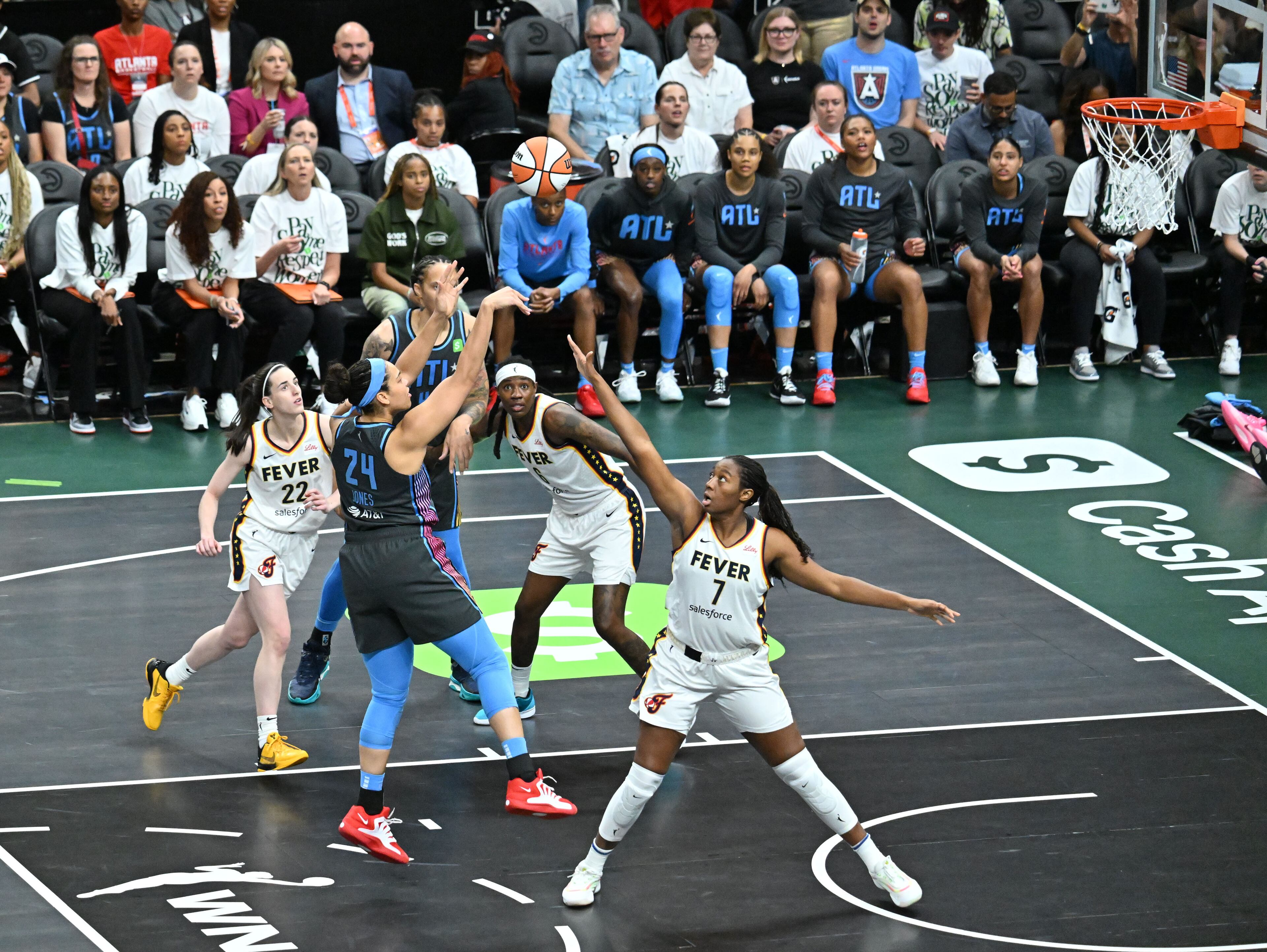 Atlanta Dream forward Brionna Jones (24) shoots over Indiana Fever forward Aliyah Boston (7) during the first half in Atlanta Dream’s home opener at State Farm Arena, Thursday, May 22, 2025, in Atlanta. (Hyosub Shin / AJC)
