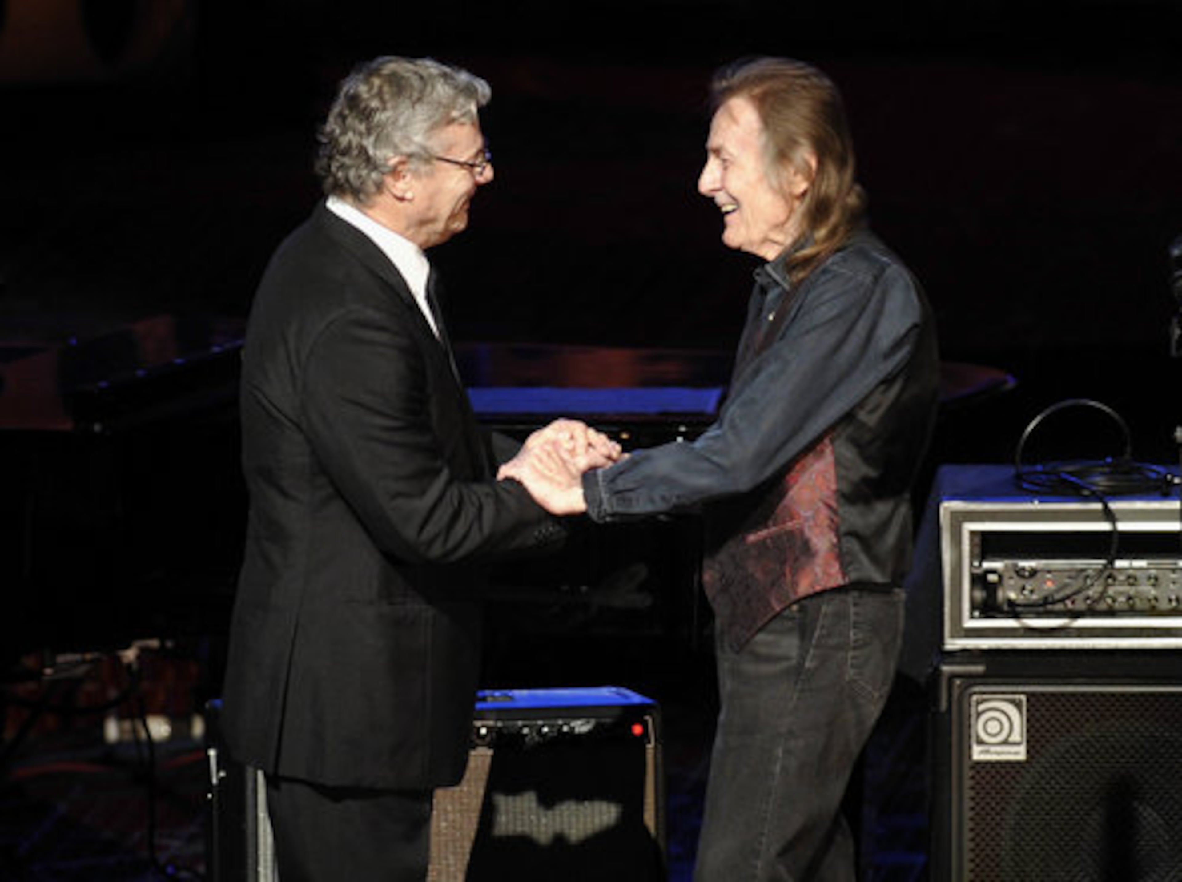 Guitarist Steve Miller (left) helps to induct singer Gordon Lightfoot, known for such hits as "The Wreck of the Edmund Fitzgerald," "Sundown," and "If You Could Read My Mind."