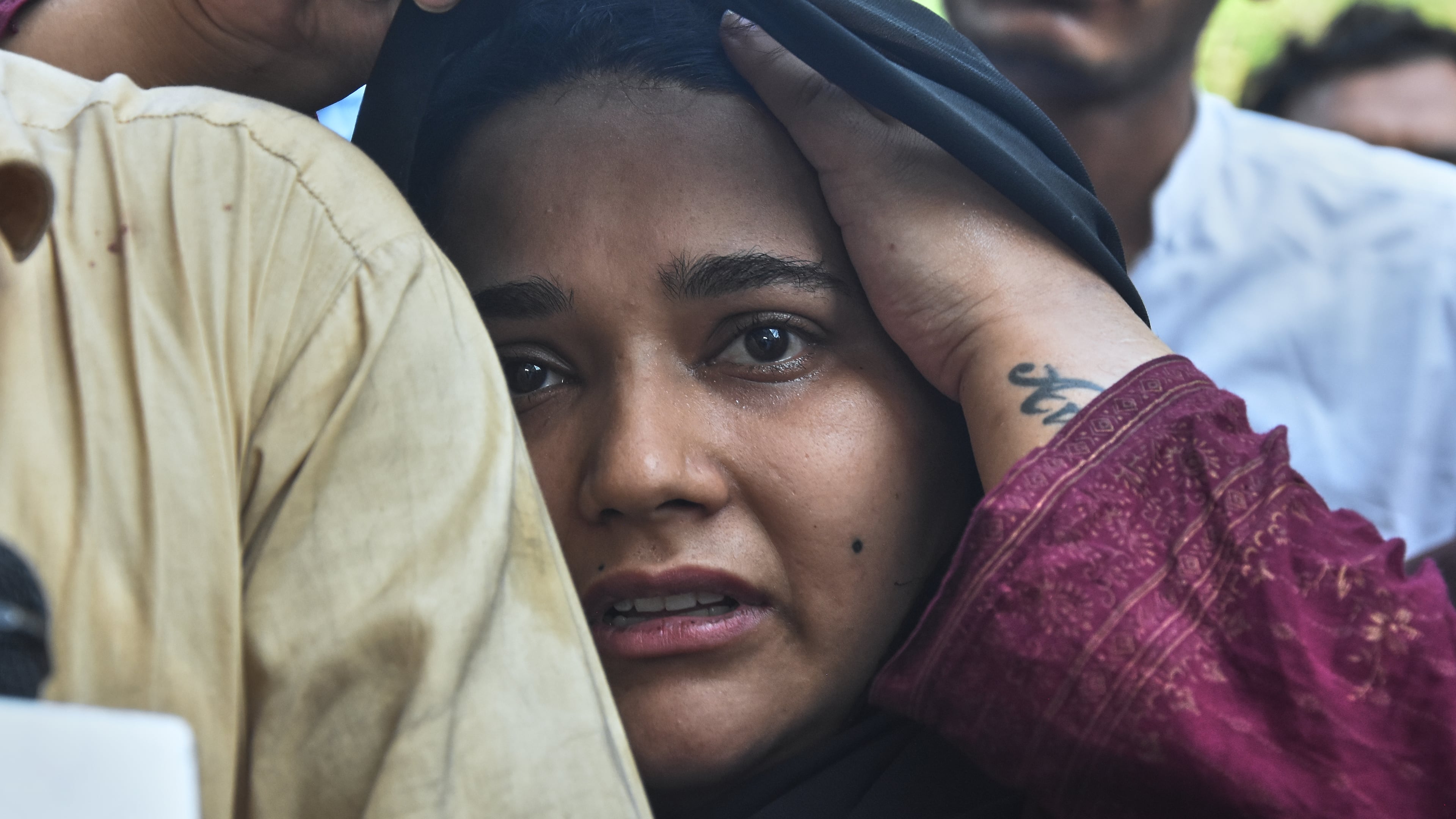 A woman, who lost her baby in a hospital fire, reacts at a hospital in Islamabad, Pakistan, Wednesday, Aug. 26, 2026. (AP Photo)