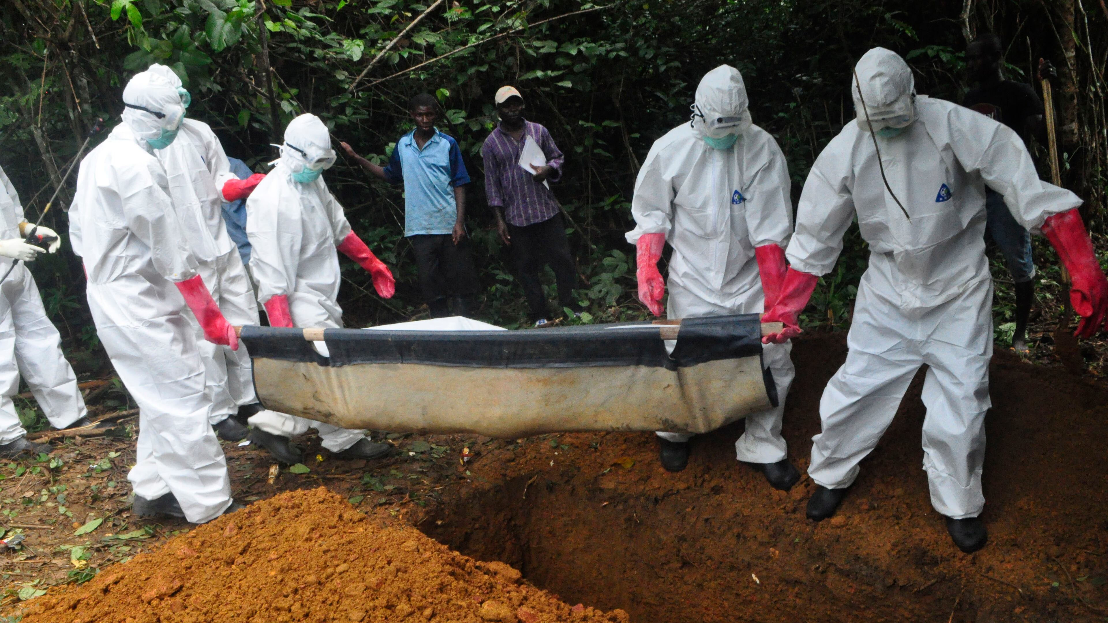 FILE : In this Saturday, Oct. 18, file photo a burial team in protective gear bury the body of a woman suspected to have died from Ebola virus in Monrovia, Liberia. The disease has ravaged a small part of Africa, but the international image of the whole continent is increasingly under siege, reinforcing some old stereotypes. (AP Photo/Abbas Dulleh, File) In this Saturday photo a burial team in protective gear bury the body of a woman suspected to have died from Ebola virus in Monrovia, Liberia. The disease has ravaged a small part of Africa, but the international image of the whole continent is increasingly under siege. AP /Abbas Dulleh
