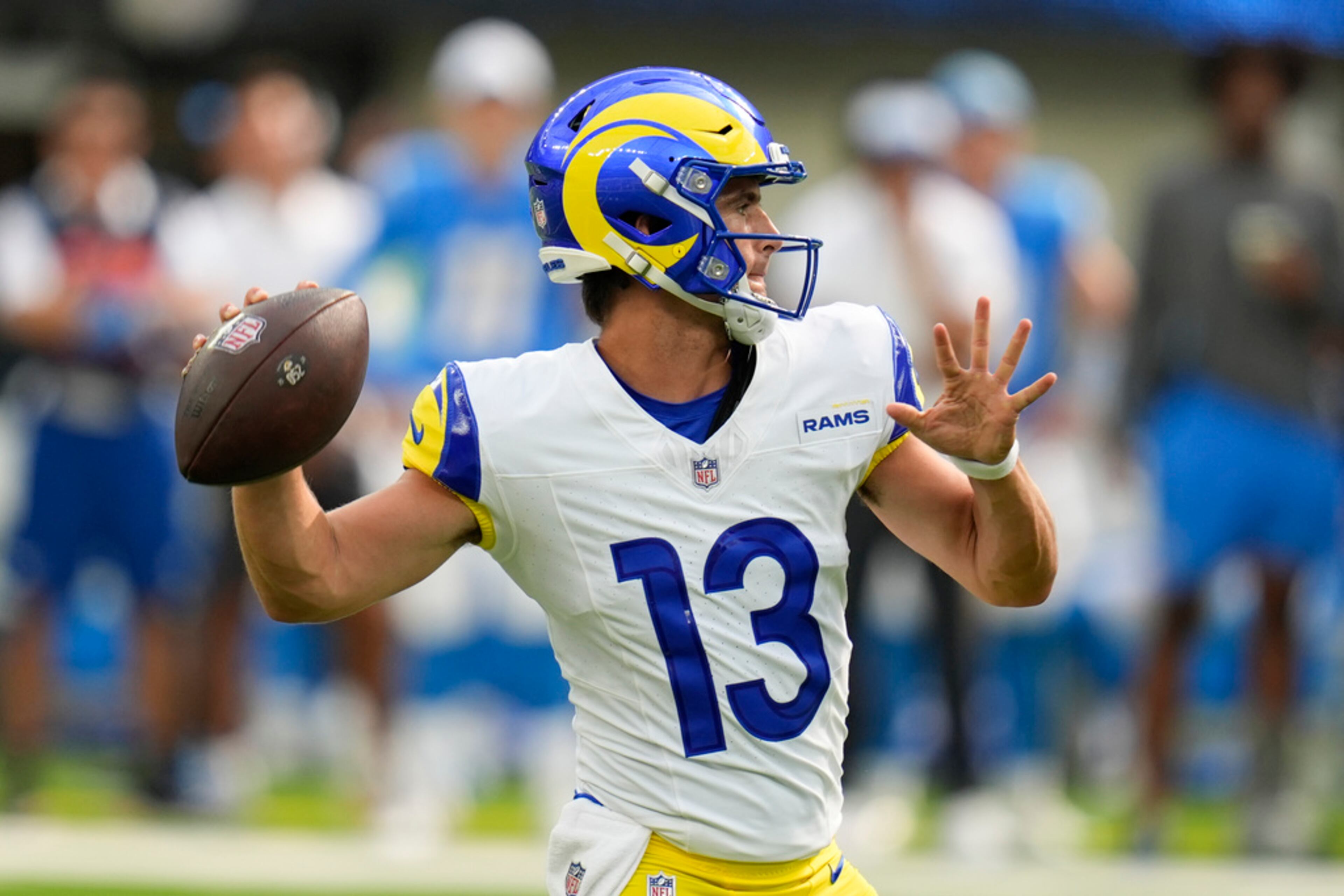 Los Angeles Rams quarterback Stetson Bennett throws a pass during the first half of a preseason NFL football game against the Los Angeles Chargers, Saturday, Aug. 17, 2024, in Inglewood, Calif. (AP Photo/Gregory Bull)