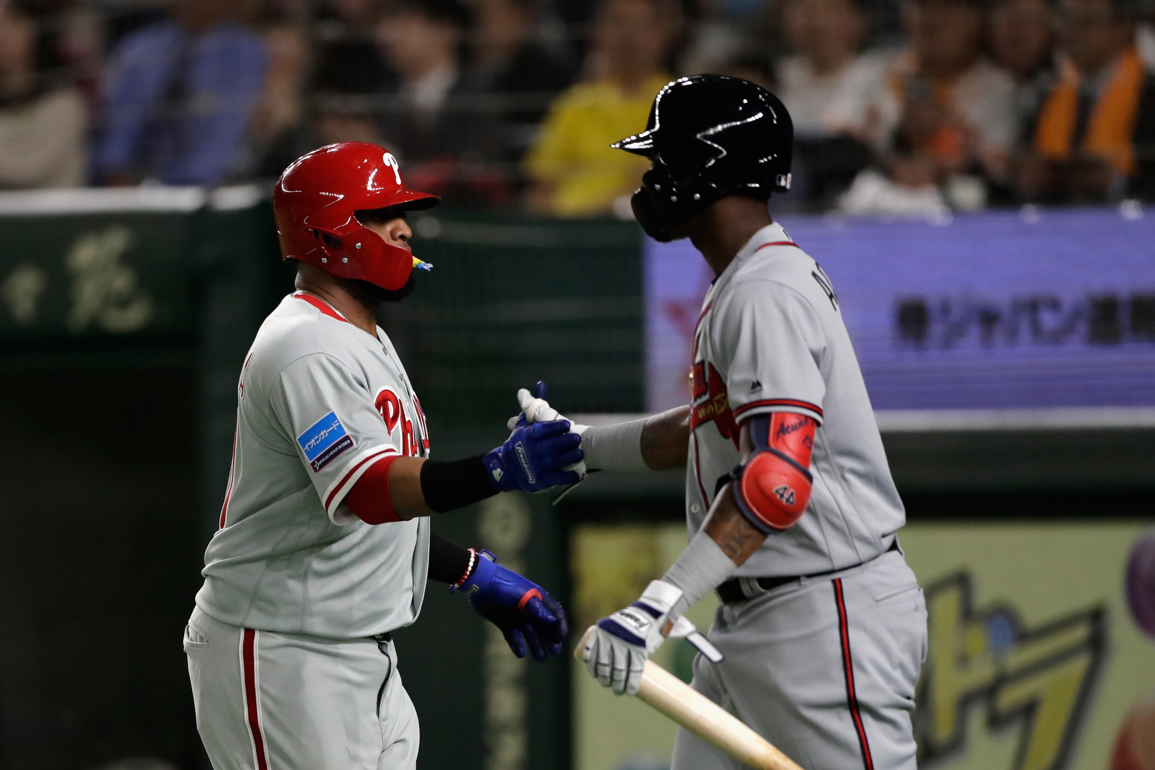 TOKYO, JAPAN - NOVEMBER 08: Infielder Carlos Santana (L) #41 of the Philadelhia Phillies celebrates scoring a run to make it 3-0 with Outfielder Ronald Acuna Jr. #13 of the Atlanta Braves in the top of 3rd inning during the exhibition game between Yomiuri Giants and the MLB All Stars at Tokyo Dome on November 8, 2018 in Tokyo, Japan. (Photo by Kiyoshi Ota/Getty Images)