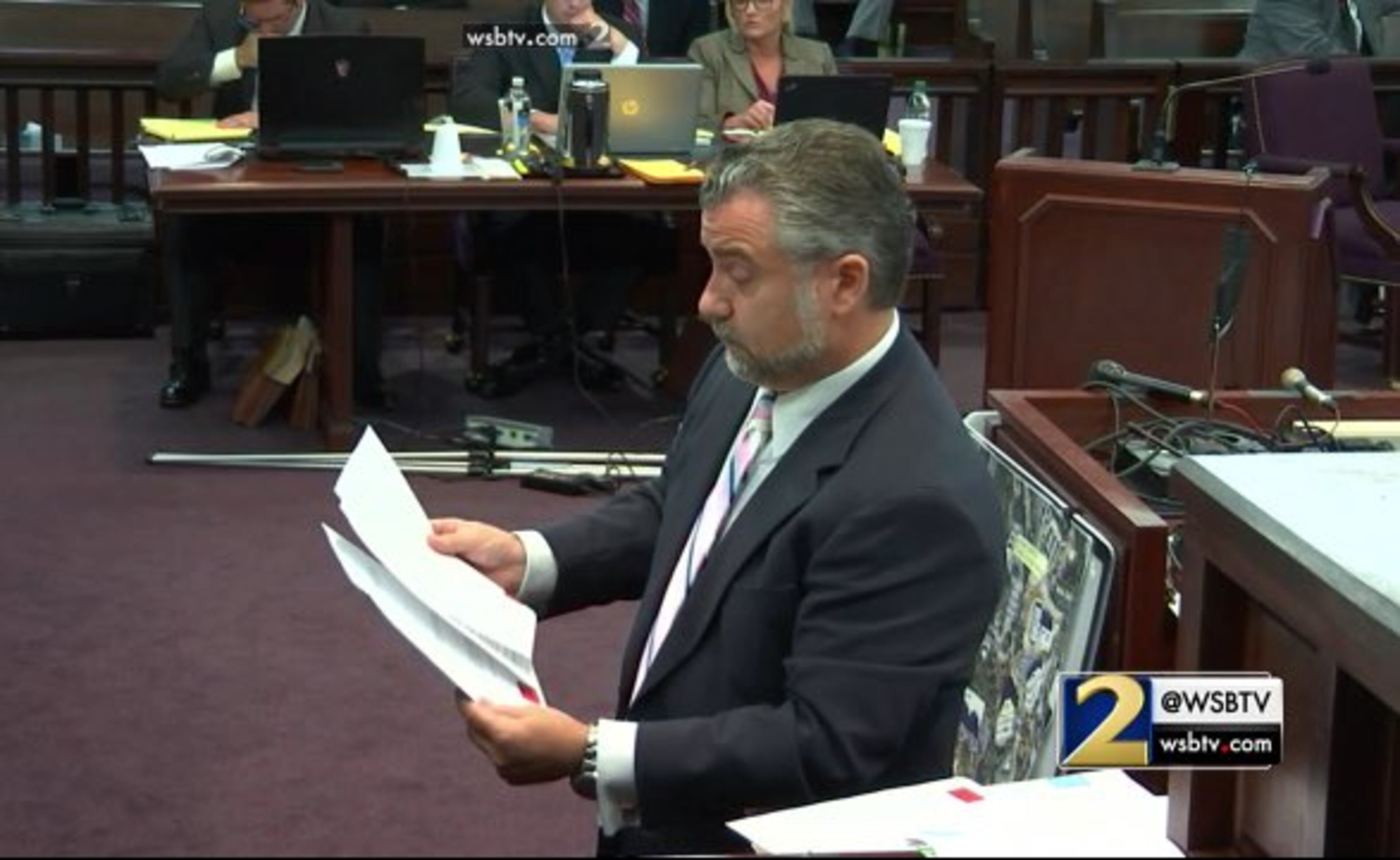 Defense attorney Maddox Kilgore continues to cross examine Cobb County lead detective Phil Stoddard during the murder trial of Justin Ross Harris at the Glynn County Courthouse in Brunswick, Ga., on Tuesday, Oct. 25, 2016. Kilgore pointed out that the day before Cooper's death, Harris researched going on a cruise with Cooper but that detectives made no effort to interview the travel agency. The defense also got Stoddard to concede that Harris did not search for the veterinarian's video about hot car deaths, as the detectives had previously stated. (screen capture via WSB-TV)