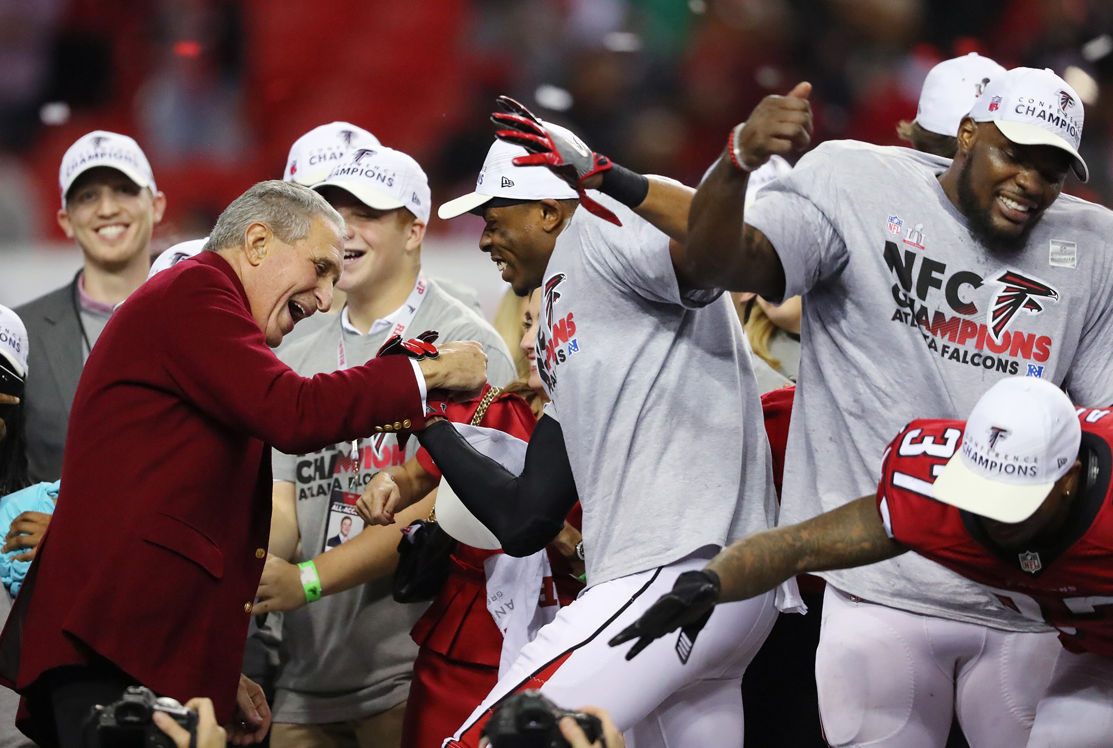 January 22, 2017, Atlanta: Falcons owner Arthur Blank dances on stage with his players after beating the Packers 44-21 in the NFL football NFC Championship game on Sunday, Jan. 22, 2017, in Atlanta. Curtis Compton/ccompton@ajc.com