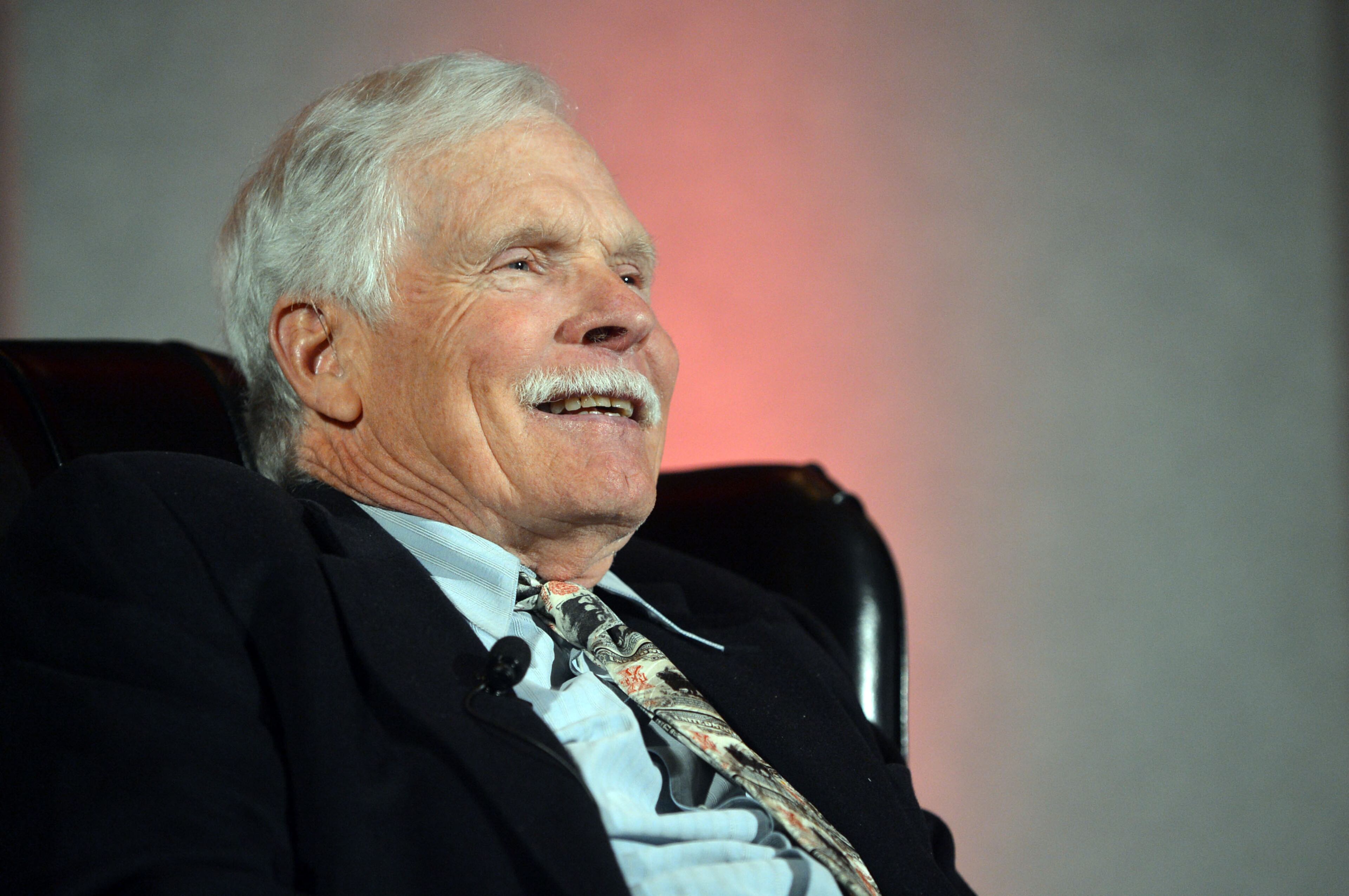 Ted Turner, back from hospitalization in South America, talks during the Technology Association of Georgia 2014 Technology Summit at the Cobb Galleria Centre Wednesday, March 26, 2014. Turner, the Atlanta billionaire and founder of Turner Broadcasting System, suffered from appendicitis while in the Patagonia region earlier this month. He underwent surgery at a hospital in Buenos Aires. On March 10, he thanked supporters and well-wishers, noting he was recuperating and “looking forward to getting back to business as usual.”