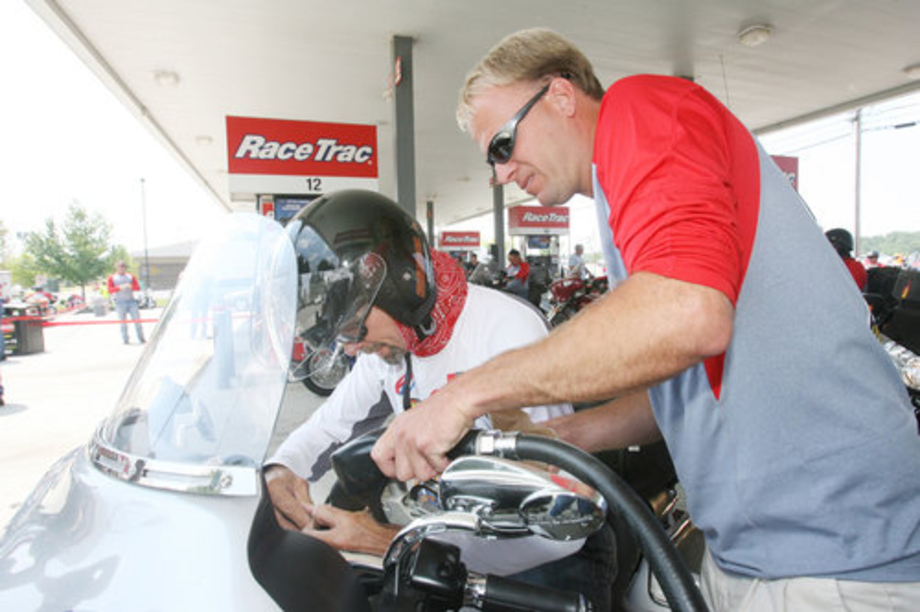 Ride crew member Kolin Aspegren fills up Petty's tank. The ride's website says that since its 1995 inception, 5,700 participants logged more than 7.2 million cumulative miles while donating more than $10.5 million.
