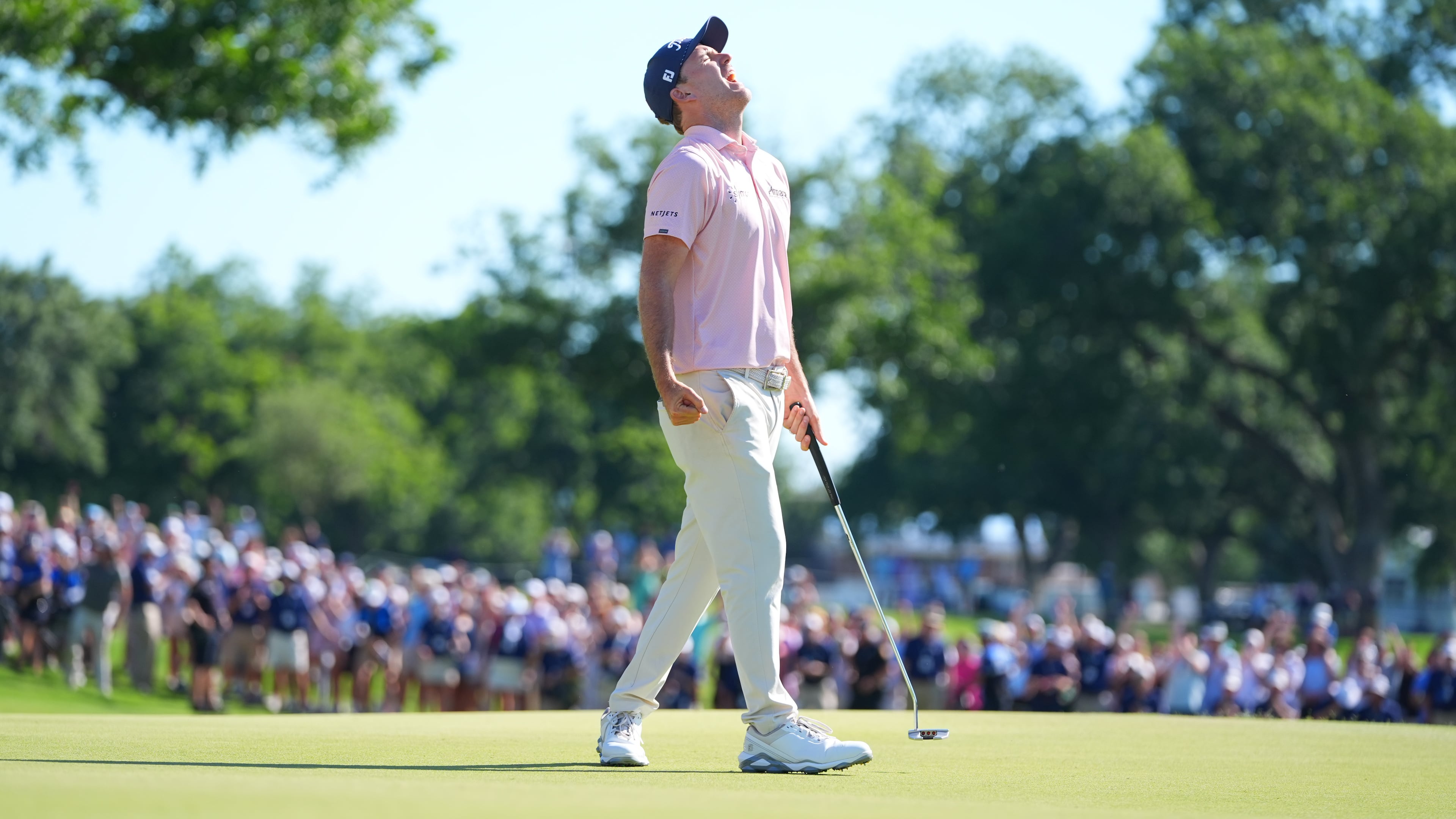 Russell Henley reacts after sinking a putt on the 18th hole during the final round of the Charles Schwab Challenge golf tournament at Colonial Country Club in Fort Worth, Texas, Sunday, May 31, 2026. (AP Photo/LM Otero)