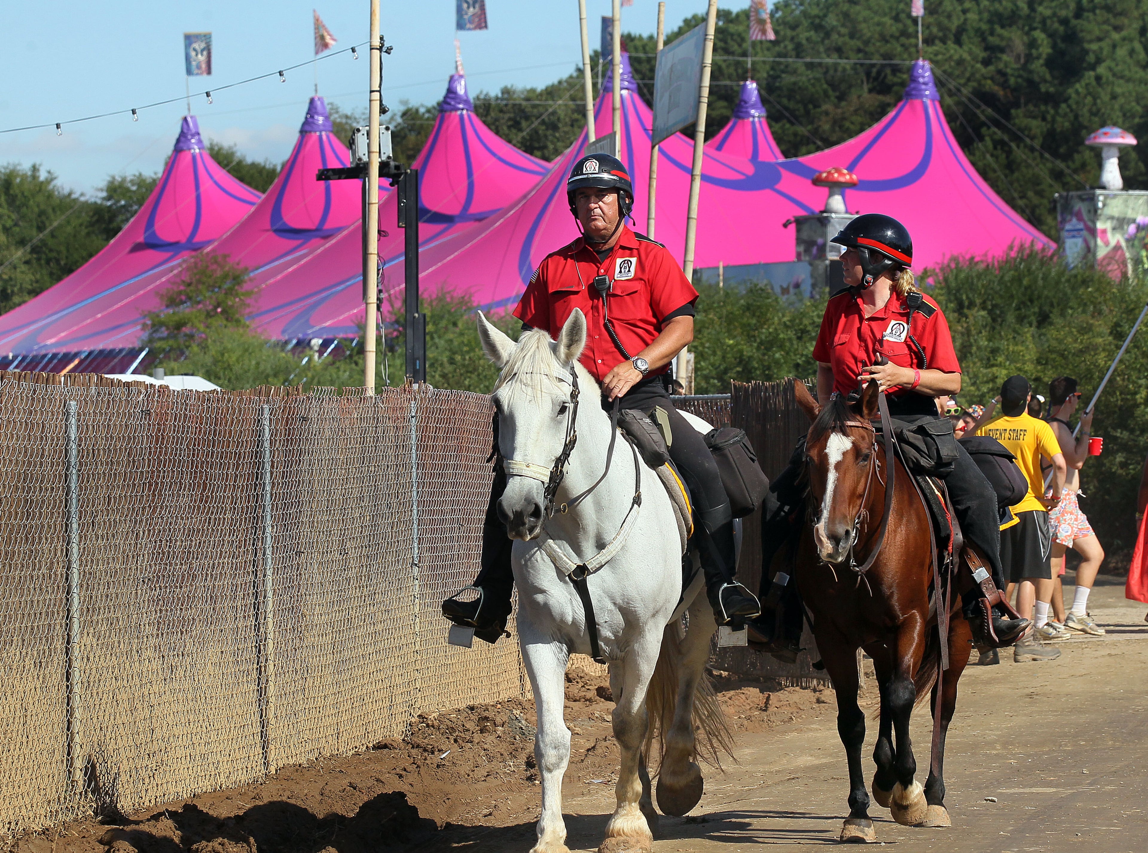 Mounted security patrols walks past the ""Dreamville" camping area at the TomorrowWorld electronic music festival in Chattahoochee Hills, South of Atlanta, on Saturday September 28th, 2013. The event has been the world's most popular electronic music festival in Europe for years. It is in the United States for the first time on the nearly 500 acre Bouchaert Farm.