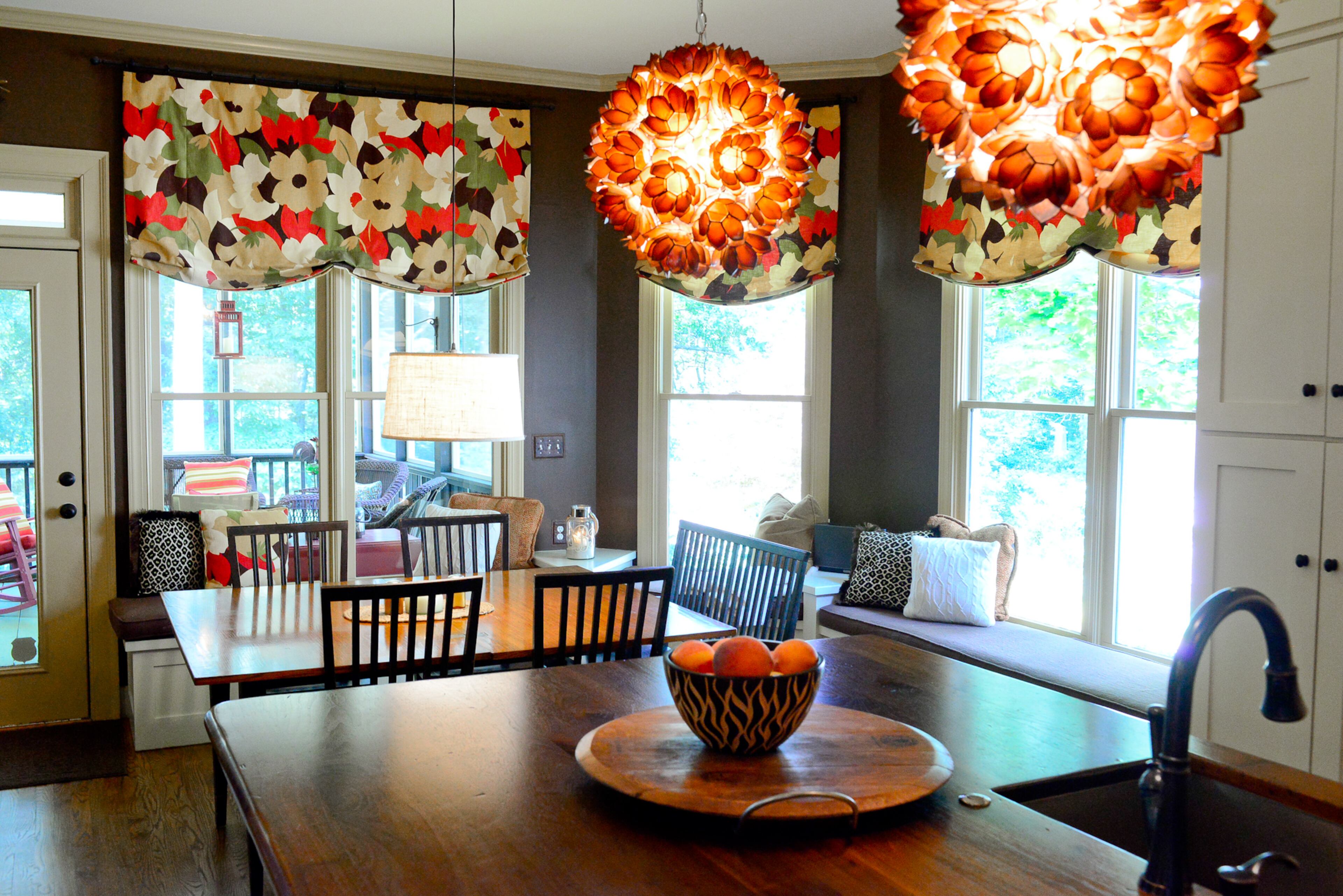 The kitchen is less compact after a 2011 renovation, with an island and table that offer seating. Adjacent to the kitchen is the family's screened porch, another entertaining spot.