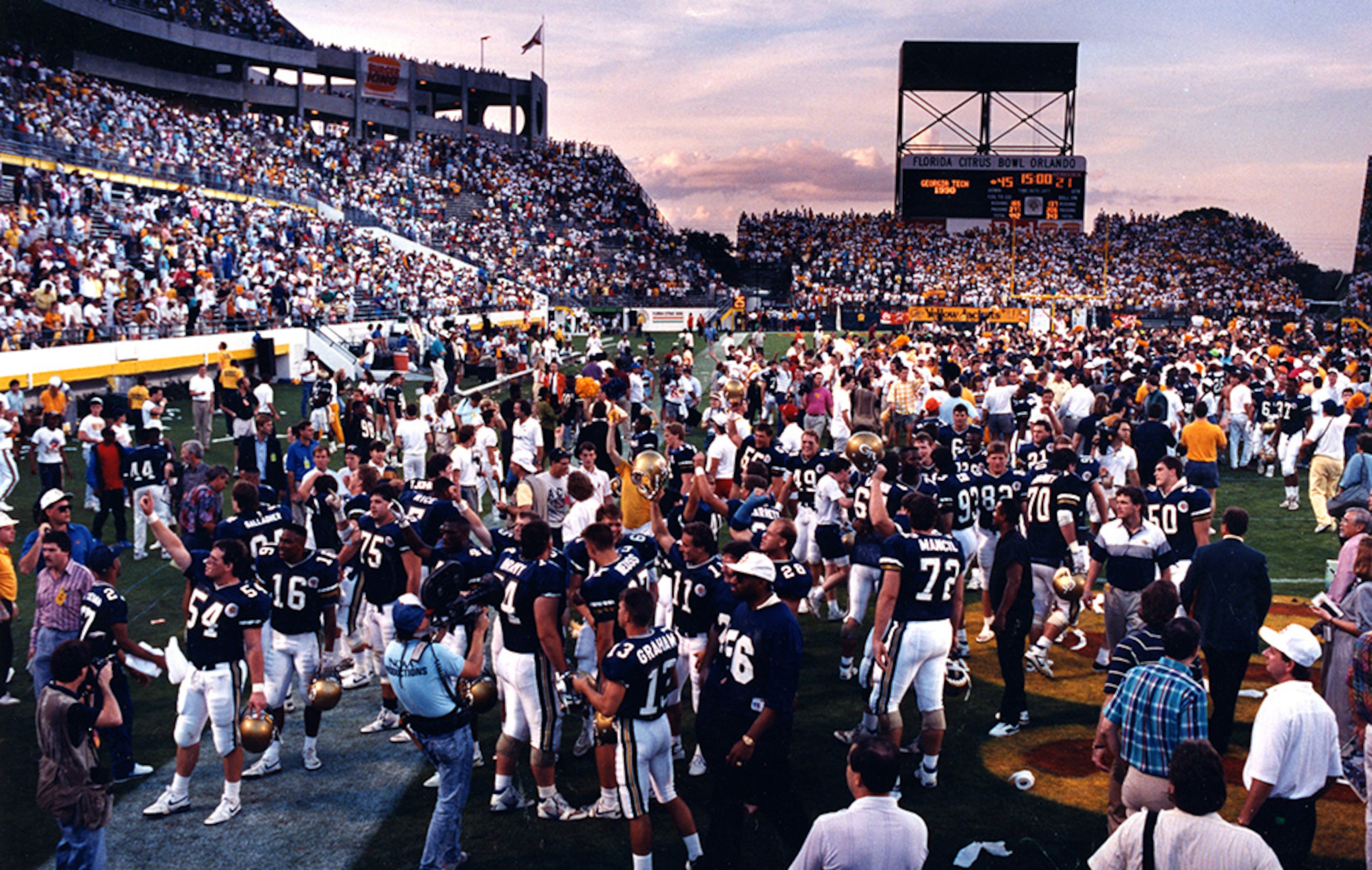 Georgia Tech players and fans celebrate their 1991 Citrus Bowl win. The following day the coaches' poll proclaimed Tech the national champion, while the AP crowned Colorado, which had a loss at Illinois and a neutral-site tie against Tennessee, as the top team in the land. Georgia Tech was forced to split the national title.
