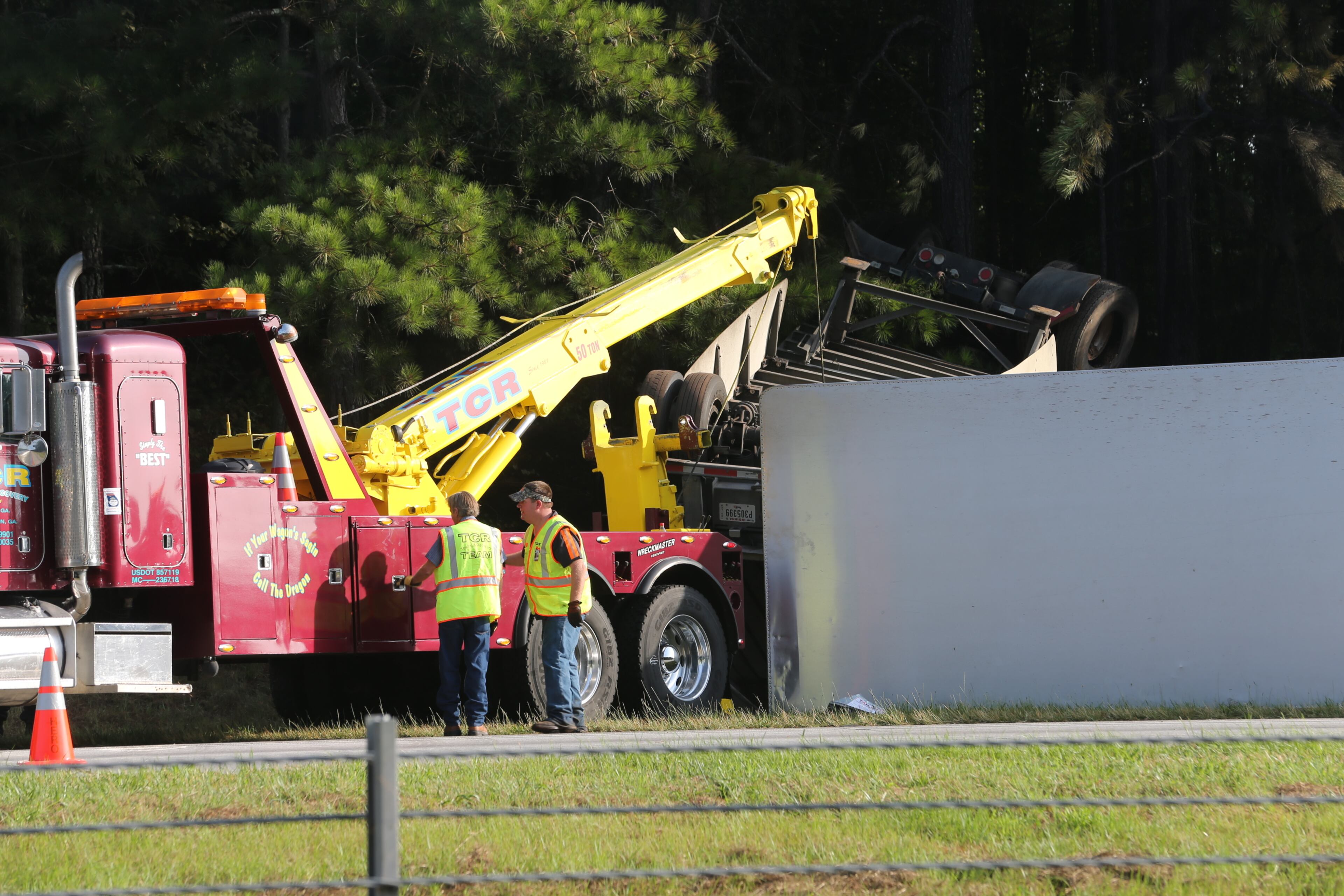 All westbound lanes of I-20 in west Georgia were shut down for about three hours Wednesday morning because of a fiery wreck involving a tractor-trailer and a bus, but one lane has now reopened. JOHN SPINK/JSPINK@AJC.COM