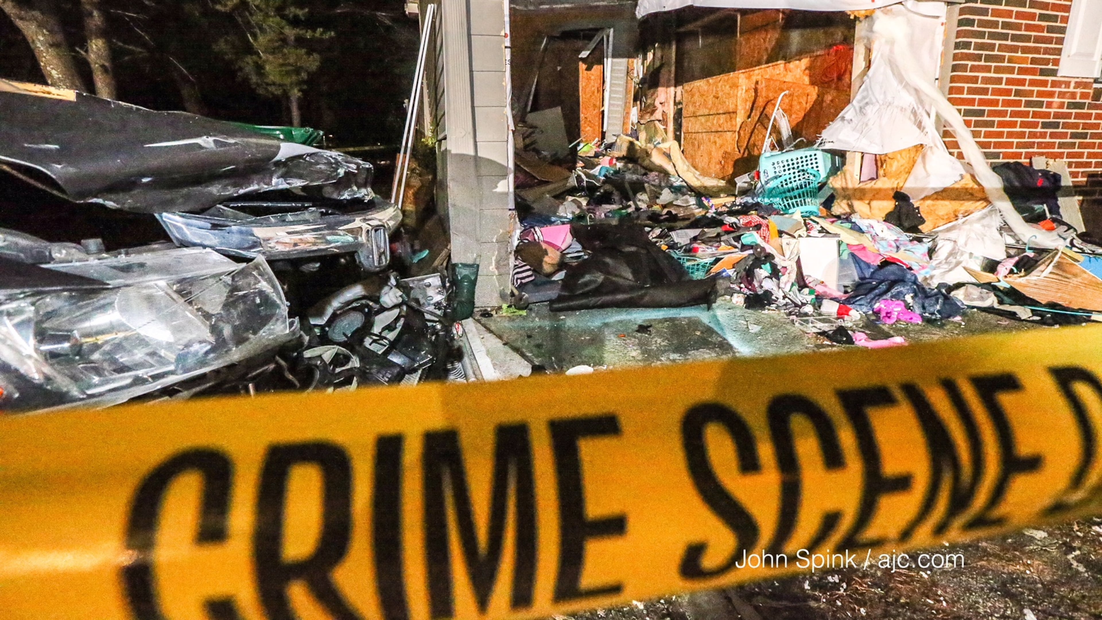 A car hit the garage and went through the back of a DeKalb County home following a deadly road rage shooting.