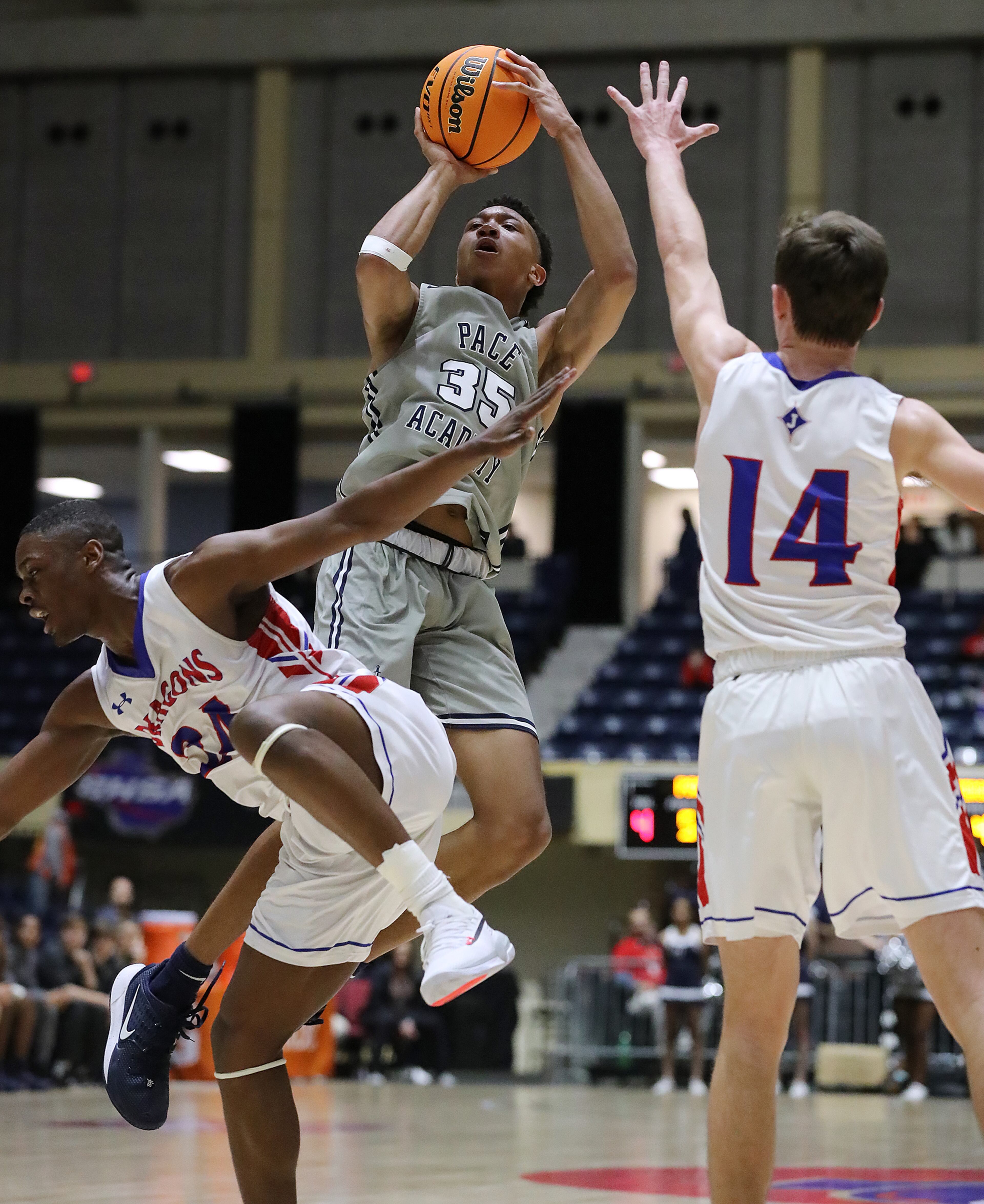 Pace Academy player Matthew Cleveland shoots for two over a double team by Jefferson defenders in the Class AAA boys state basketball championship on Thursday, March 5, 2020, in Macon. Curtis Compton ccompton@ajc.com