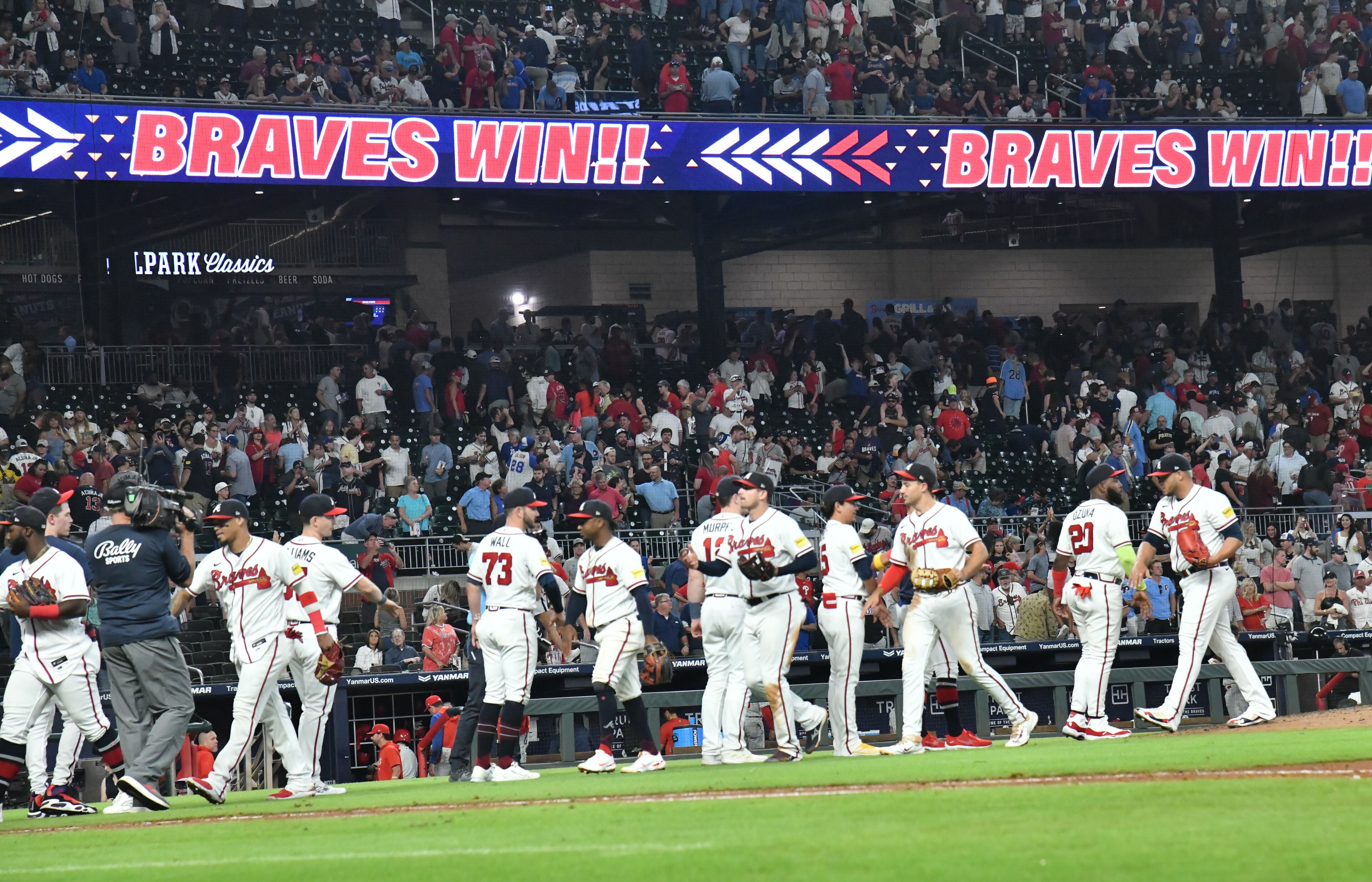 Atlanta Braves players celebrate their win over the Philadelphia Phillies at Truist Park, Tuesday, September 19, 2023, in Atlanta. (Hyosub Shin / Hyosub.Shin@ajc.com)