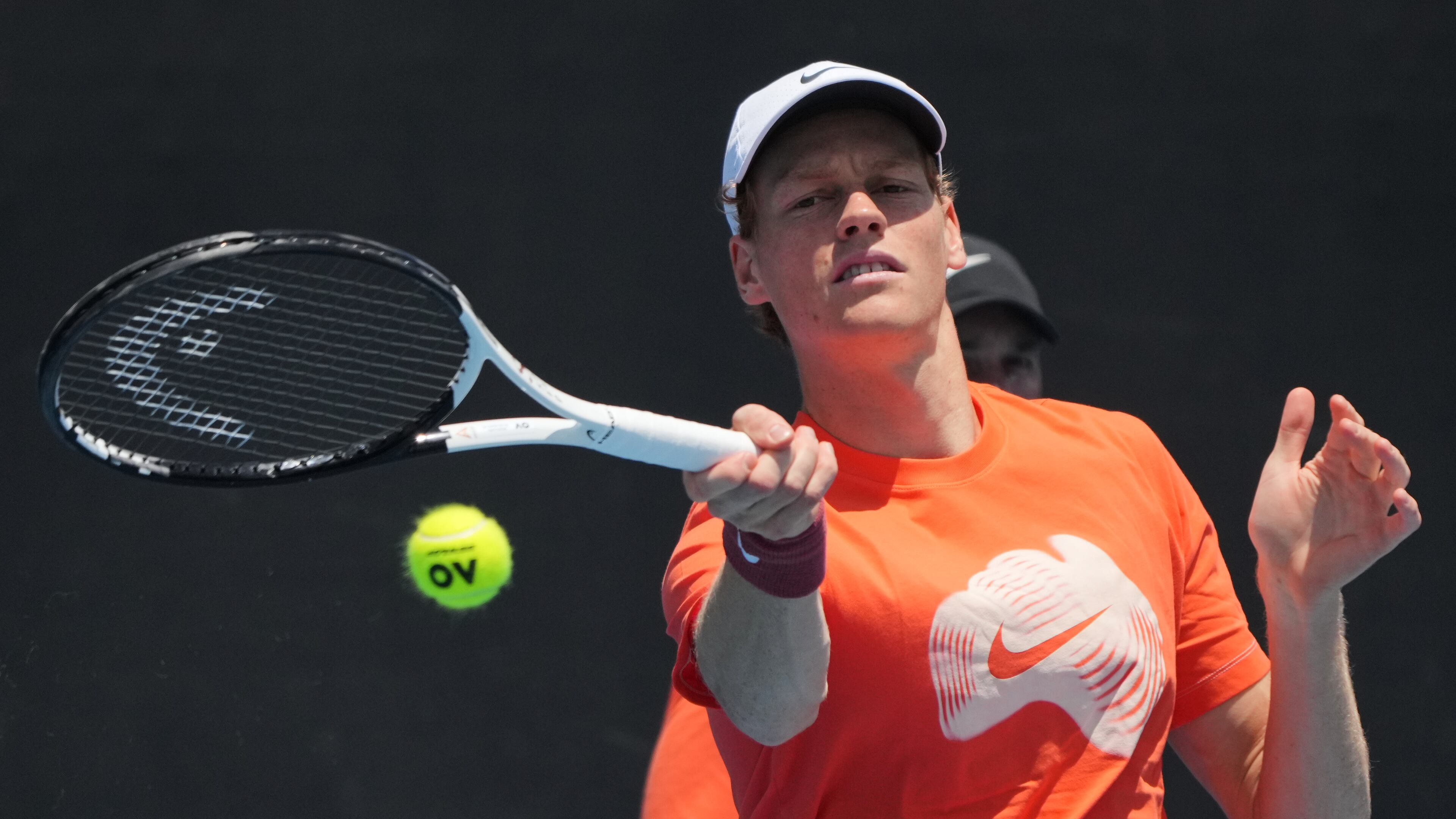 Jannik Sinner of Italy plays a forehand return to during a practice session ahead of the Australian Open tennis championship in Melbourne, Australia, Friday, Jan. 16, 2026. (AP Photo/Dita Alangkara)