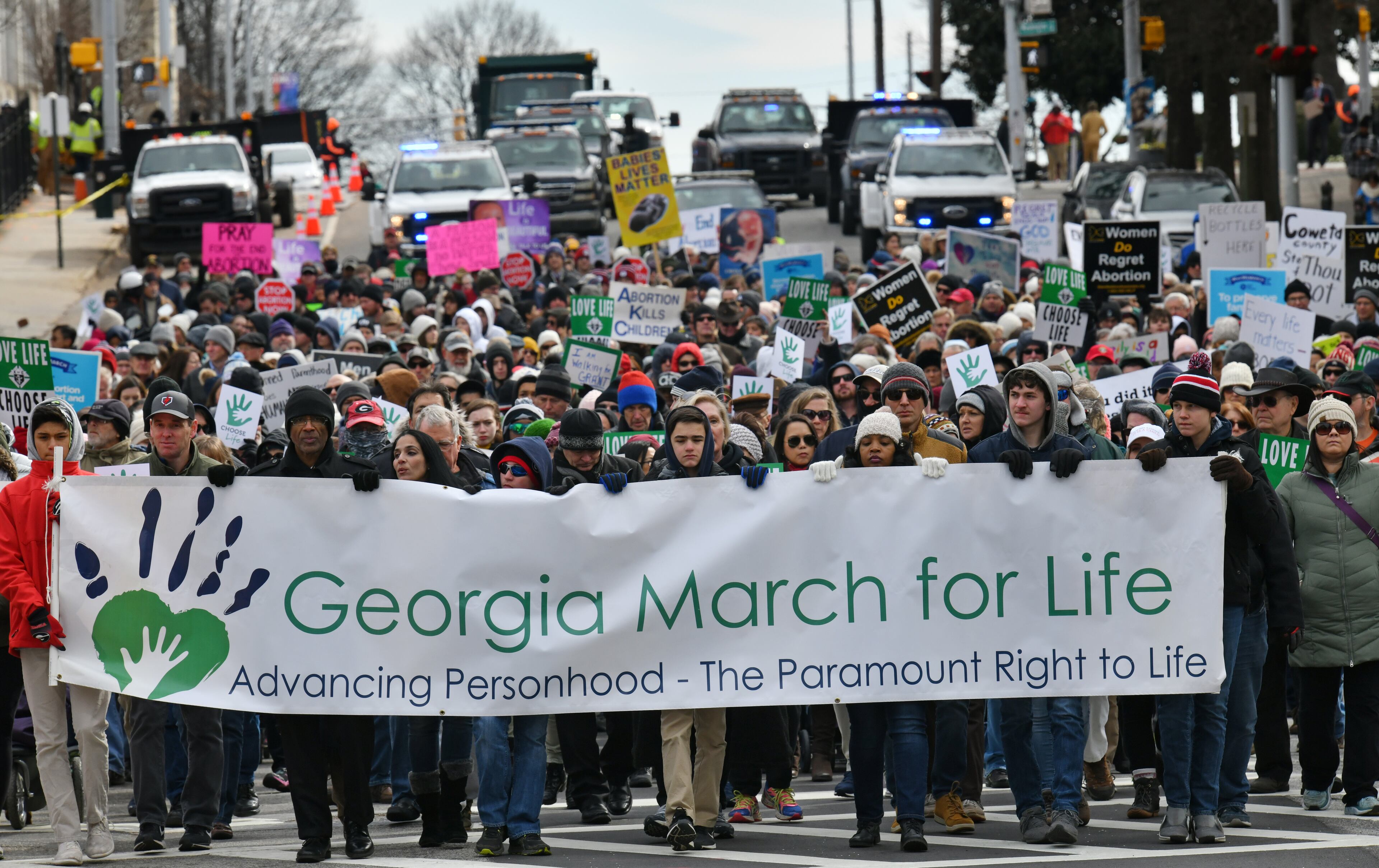 January 22, 2020 Atlanta - Hundreds of pro-life supporters walk down Martin Luther King Jr. Dr. during the 2020 Georgia March For Life & Memorial Service to raise awareness and support of anti-abortion legislation at Liberty Plaza on Wednesday, January 22, 2020. Anti-abortion advocates scored a win last year when Georgia passed a law that would ban the procedure once a doctor can detect fetal cardiac activity. But Georgia Right to Life had urged lawmakers to vote against it - and unendorsed several Republican candidates who voted in support of it - saying the bill did not go far enough because it allowed exceptions in instances of rape and incest. (Hyosub Shin / Hyosub.Shin@ajc.com)