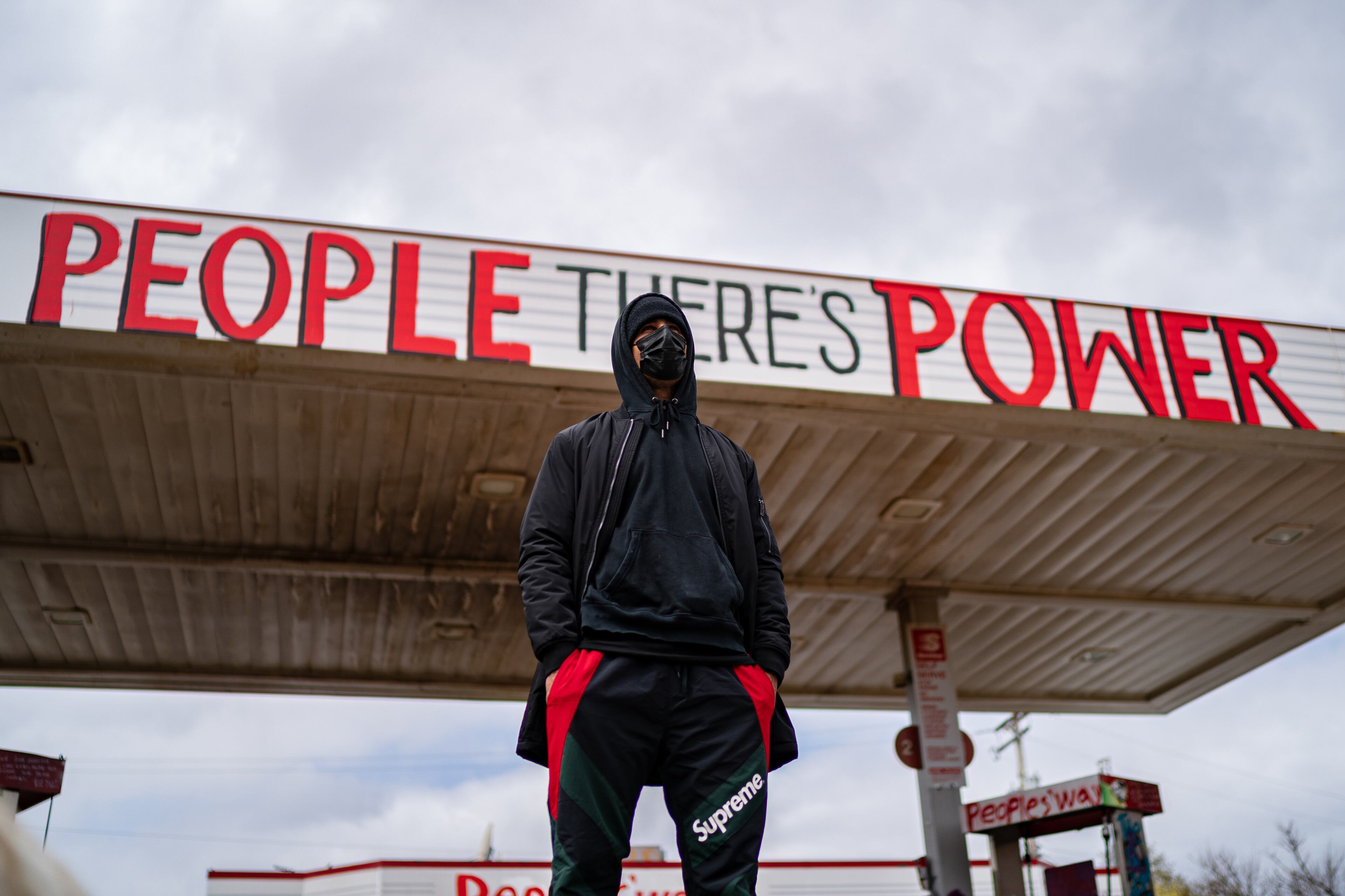 A man stands near the George Floyd memorial in Minneapolis on Tuesday, April 20, 2021, as the jury prepares to deliver verdicts in the Derek Chauvin trial. Chauvin, a former police officer is charged in the death of George Floyd while in police custody last year. (Amr Alfiky/The New York Times)