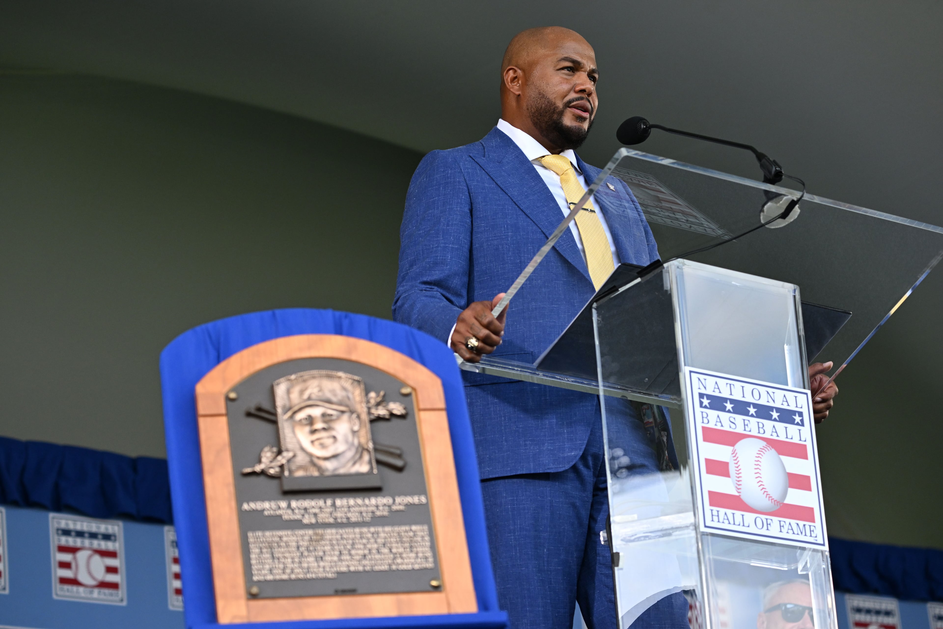 Andruw Jones speaks after being inducted into the National Baseball Hall of Fame during the 2026 National Baseball Hall of Fame Induction Ceremony at the Clark Sports Center on Sunday, July 26, 2026, in Cooperstown, N.Y. Braves centerfielder Andruw Jones is set for induction into the National Baseball Hall of Fame as part of the Class of 2026, alongside Carlos Beltrán and Jeff Kent. (Hyosub Shin/AJC)