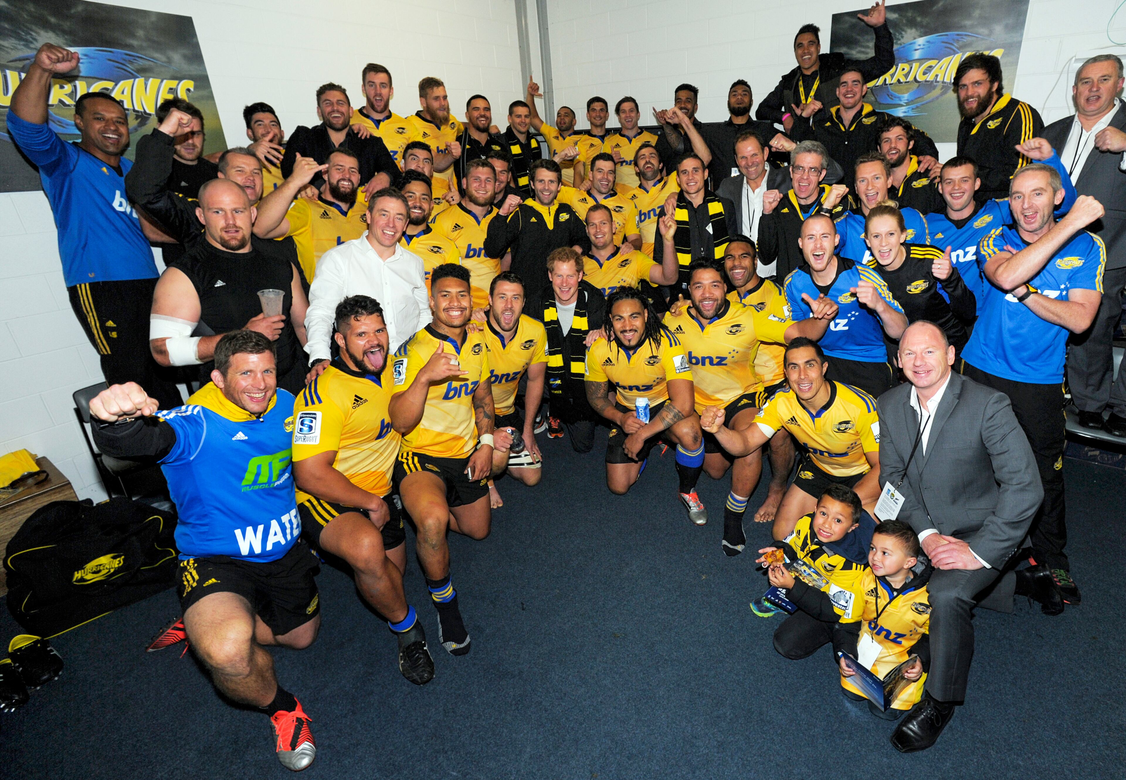 Britain's Prince Harry, center, poses with the Hurricanes team in the changing rooms after the Super Rugby match against the Sharks at Westpac Stadium in Wellington, New Zealand, on May 9, 2015.