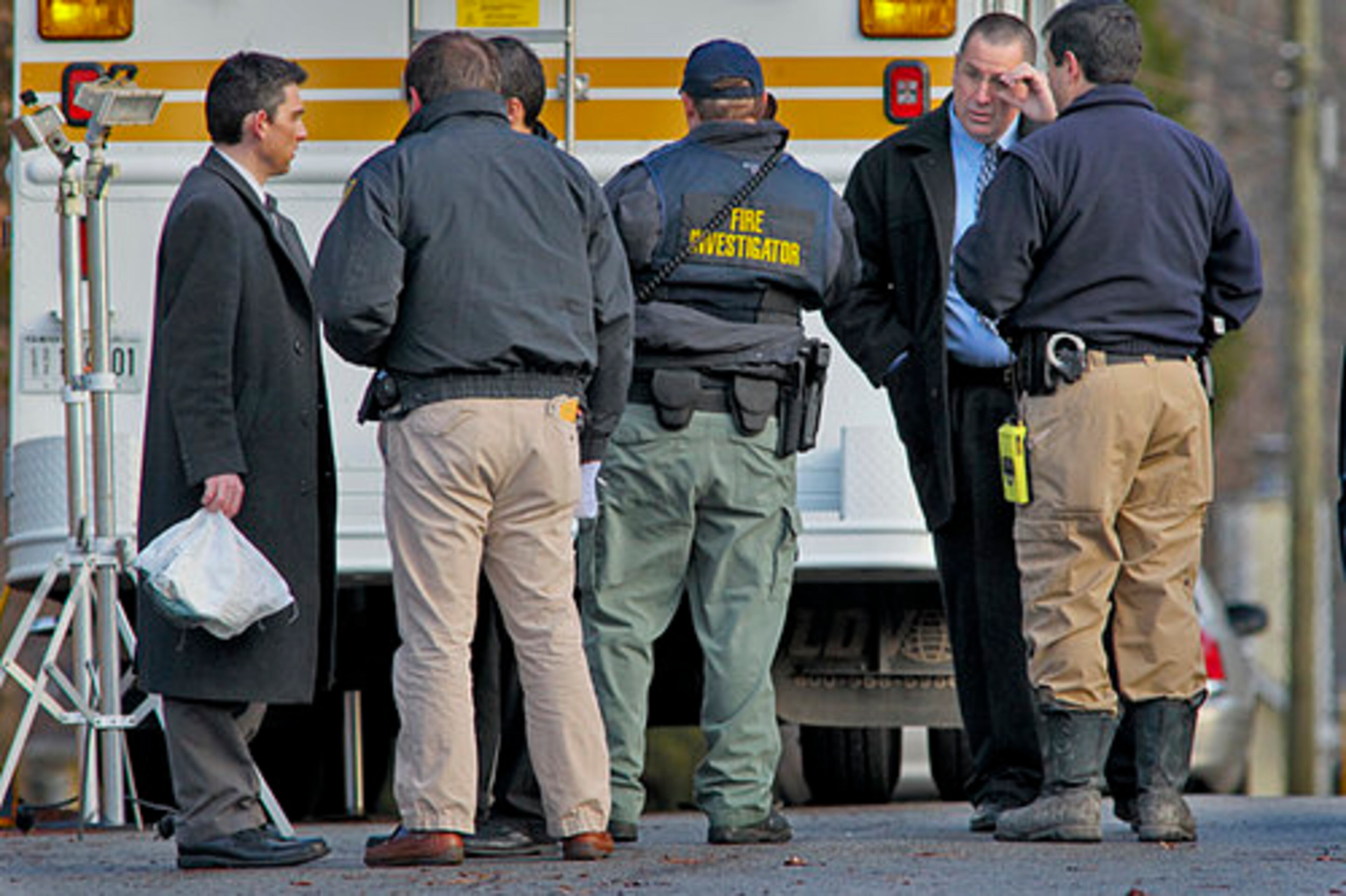 Police talk after obtaining a search warrant.