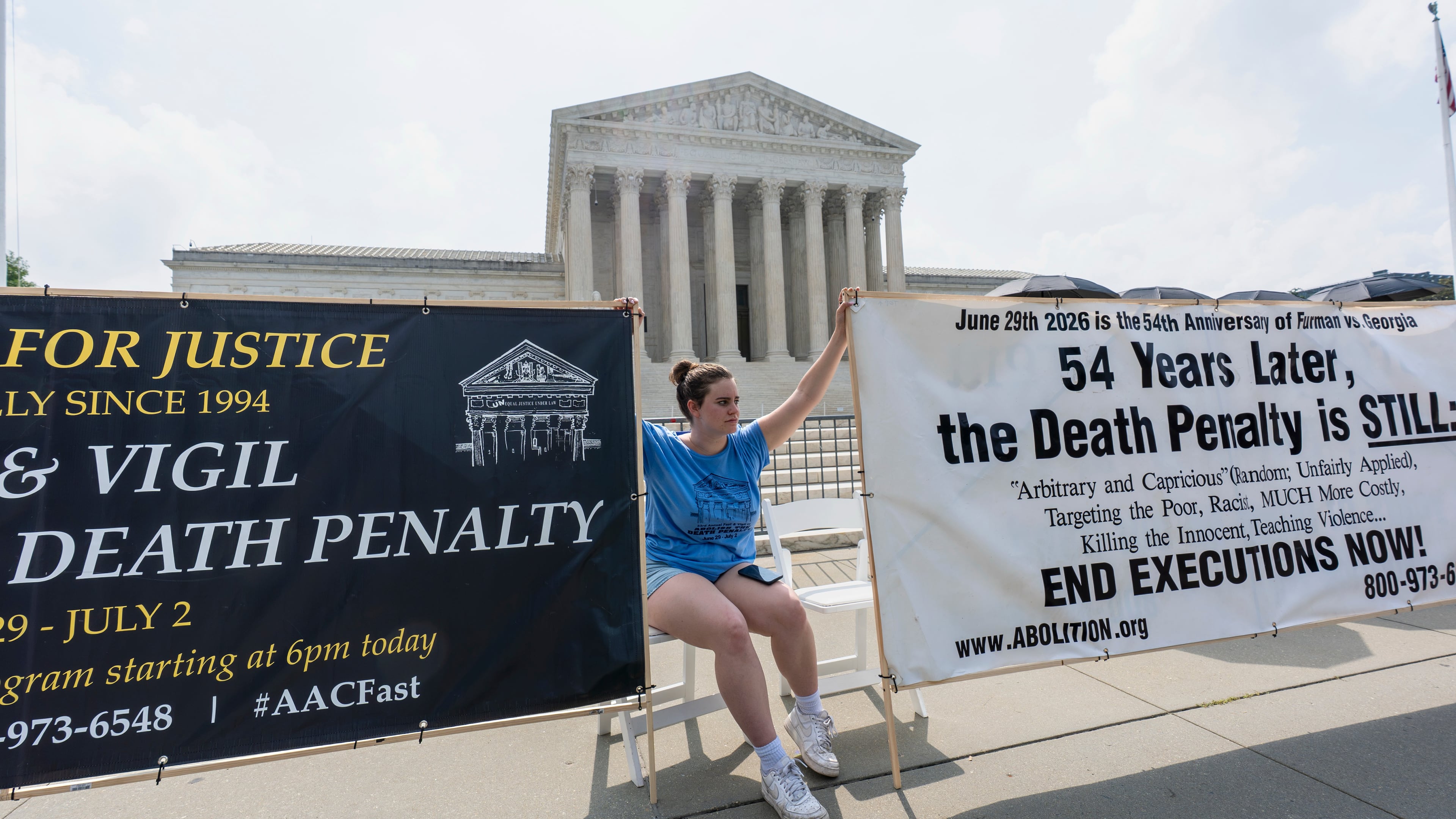Activists and demonstrators wait outside the Supreme Court for the Justices to release opinions, in Washington, Monday, June 29, 2026. (AP Photo/J. Scott Applewhite)