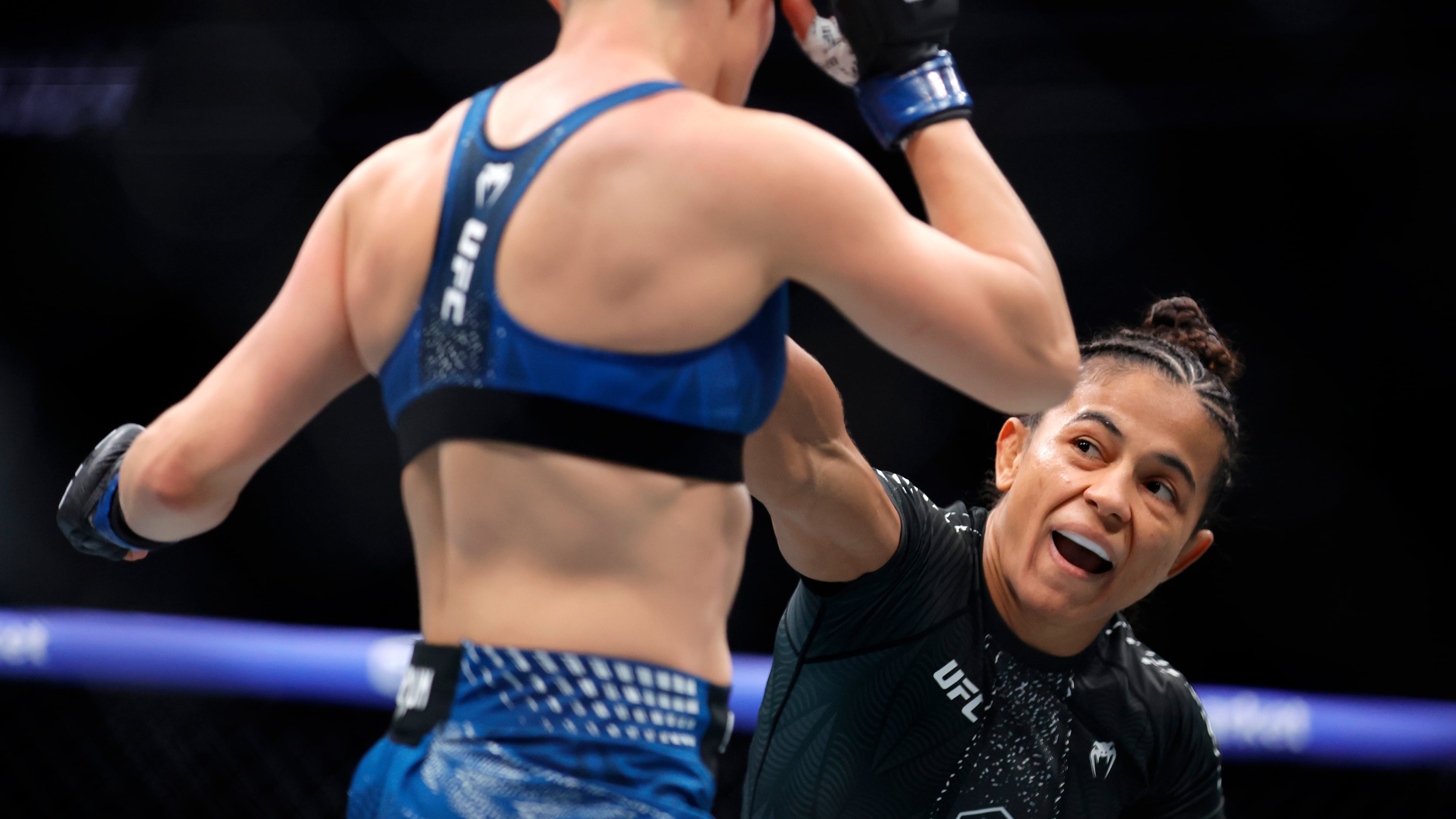 FILE - Natalia Silva, right, punches Rose Namajunas in a women's flyweight bout during the UFC 324 mixed martial arts event Saturday Jan. 24, 2026, in Las Vegas. (AP Photo/Steve Marcus, File)